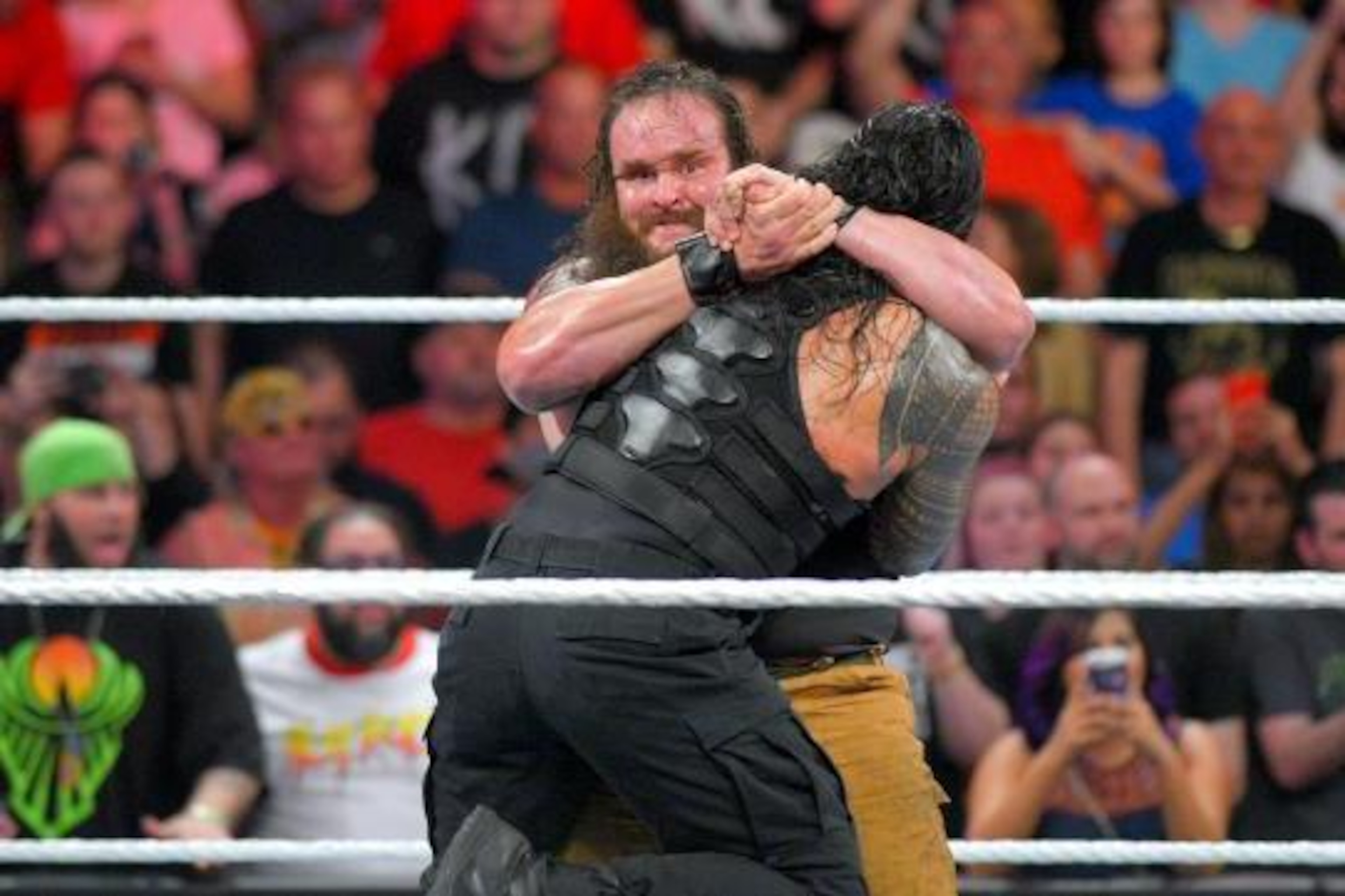 Braun Strowman attacks Roman Reigns after his in-ring debut.