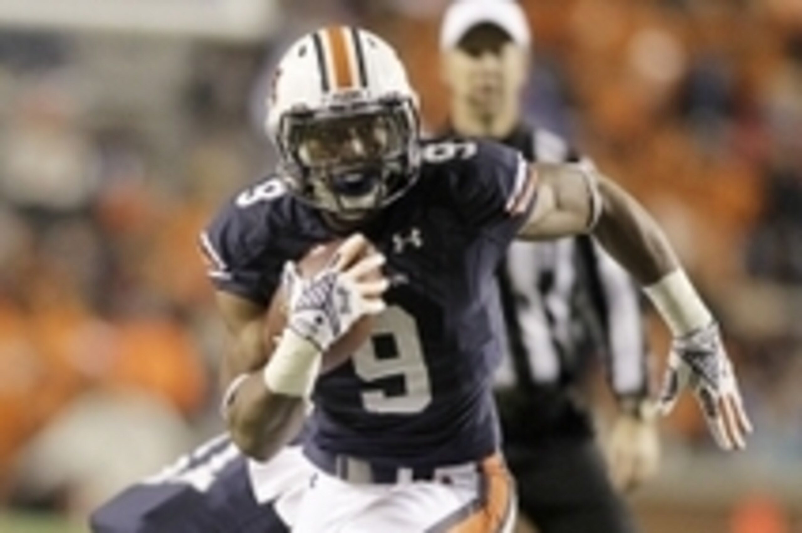 Nov 22, 2014; Auburn, AL, USA; Auburn Tigers running back Roc Thomas (9) carries against the Samford Bulldogs during the second half at Jordan Hare Stadium. Auburn beat the Bulldogs 31-7. Mandatory Credit: John Reed-USA TODAY Sports Nov 22, 2014; Auburn, AL, USA; Auburn Tigers running back Roc Thomas (9) carries against the Samford Bulldogs during the second half at Jordan Hare Stadium. Auburn beat the Bulldogs 31-7. Mandatory Credit: John Reed-USA TODAY Sports