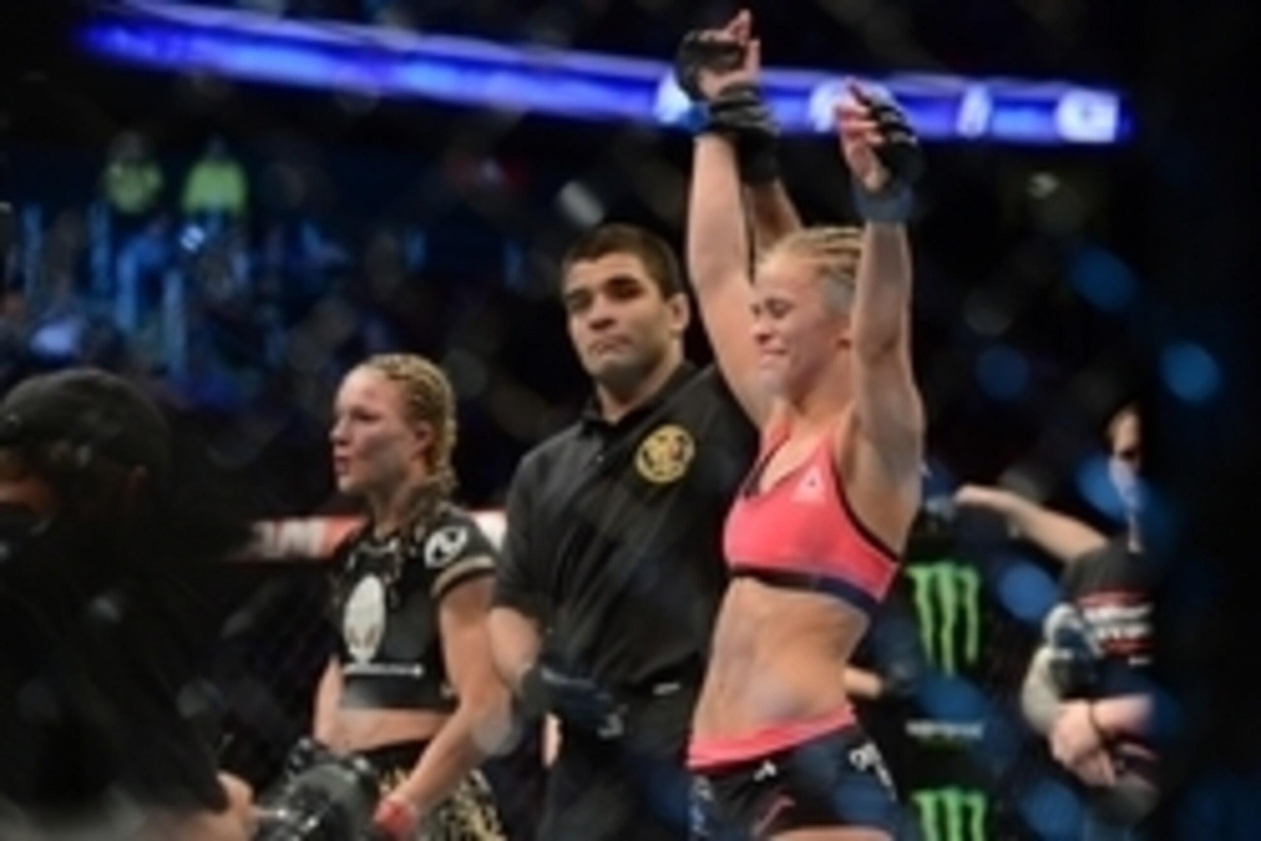 Apr 18, 2015; Newark, NJ, USA;  Paige VanZant (blue) celebrates after her fight against Felice Herrig (red) during UFC Fight Night at Prudential Center. VanZant won via unanimous decision. Mandatory Credit: Joe Camporeale-USA TODAY Sports