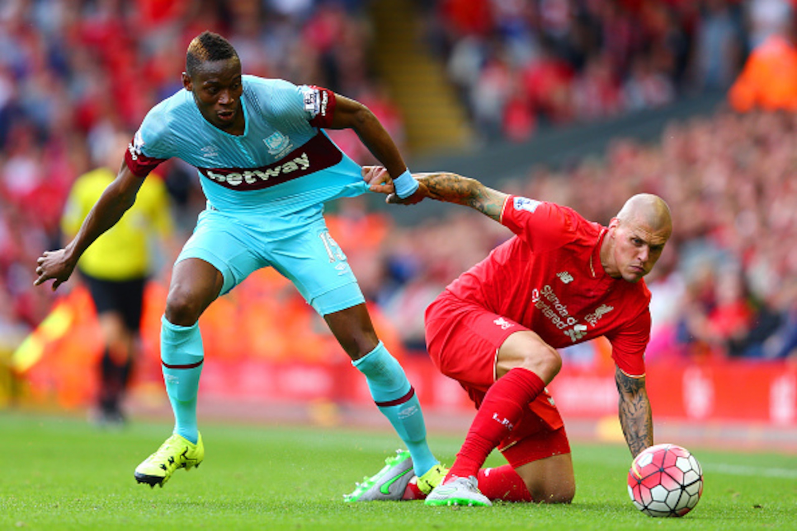 LIVERPOOL, ENGLAND - AUGUST 29:  Diafra Sakho of West Ham United and Martin Skrtel of Liverpool compete for the ball during the Barclays Premier League match between Liverpool and West Ham United at Anfield on August 29, 2015 in Liverpool, England.  (Phot