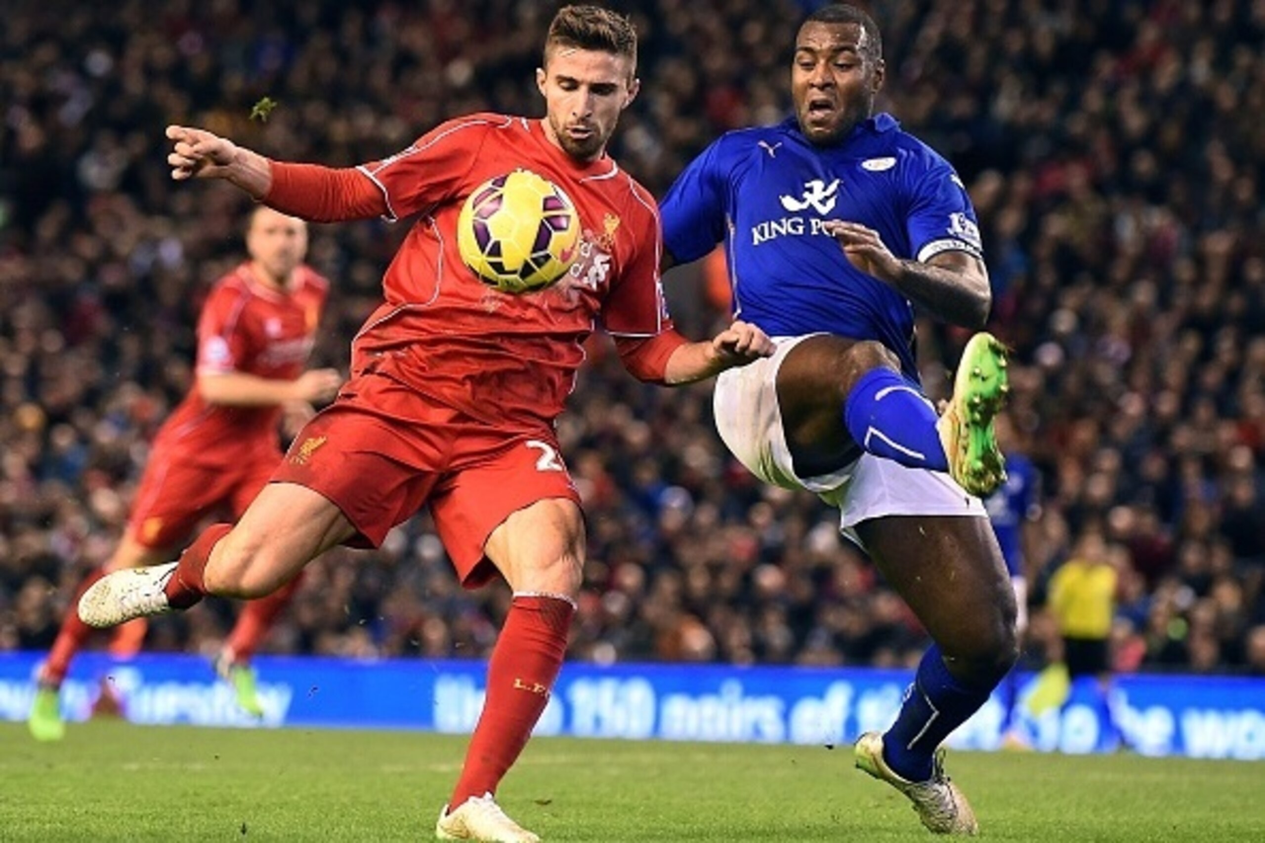 Leicester City's English defender Wes Morgan (R) defends against Liverpool's Italian striker Fabio Borini during the English Premier League football match between Liverpool and Leicester City at Anfield in Liverpool, north west England, on January 1, 2015