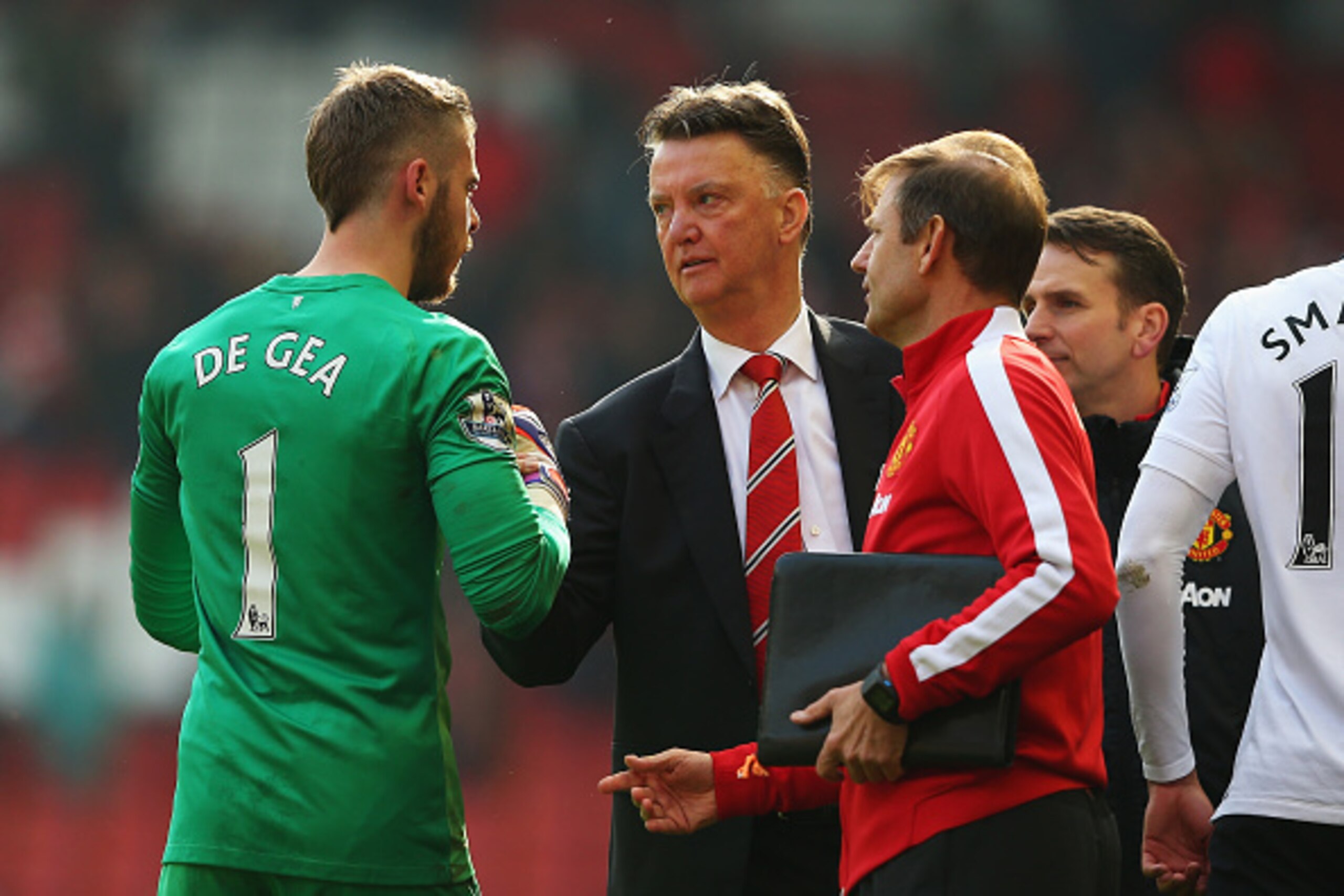LIVERPOOL, ENGLAND - MARCH 22:  Louis van Gaal, manager of Manchester United celebrates victory with David De Gea of Manchester United after the Barclays Premier League match between Liverpool and Manchester United at Anfield on March 22, 2015 in Liverpoo
