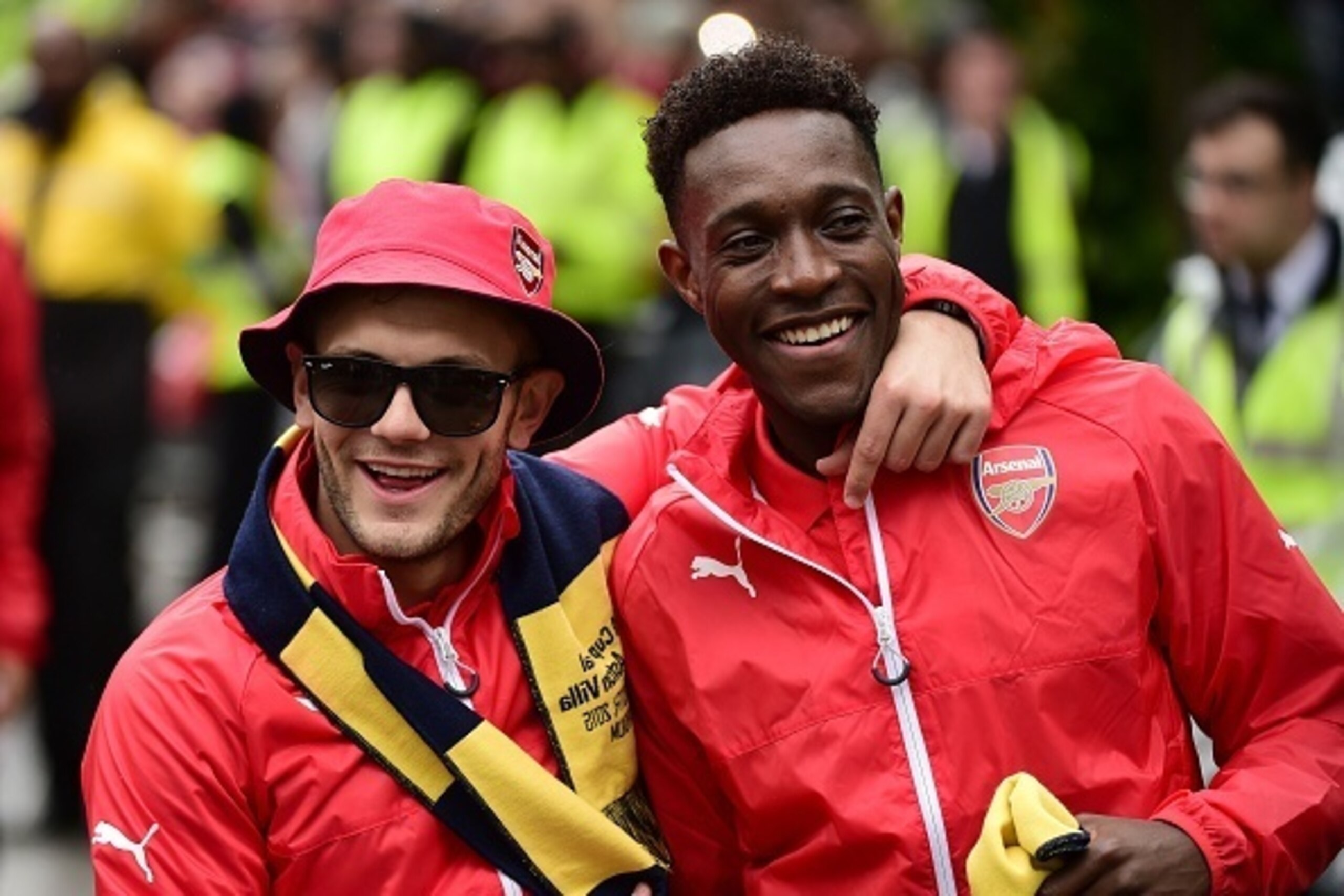 Arsenal's English midfielder Jack Wilshere and Arsenal's English striker Danny Welbeck react during the Arsenal victory parade in London on May 31, 2015, following their win in the English FA Cup final football match on May 30, 2014 against Aston Villa. A