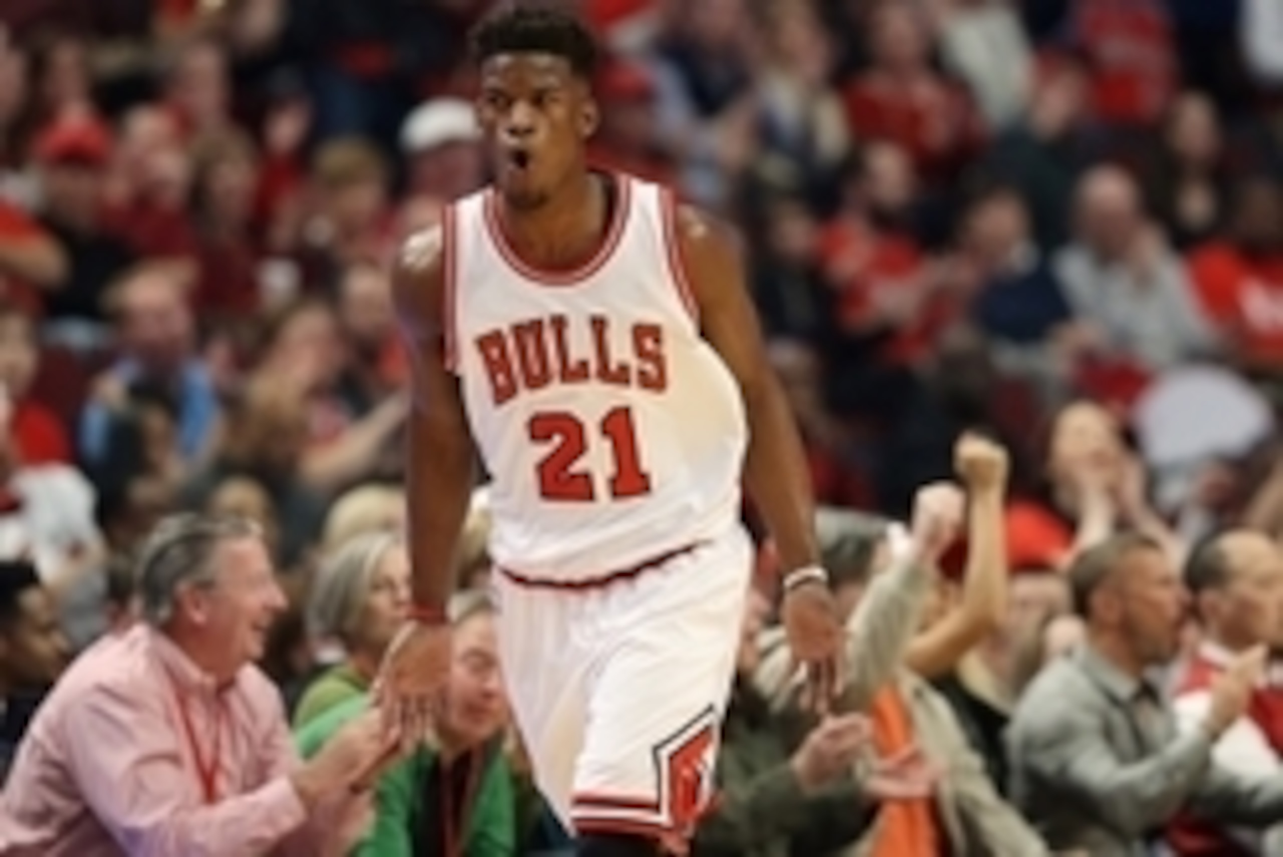 Apr 18, 2015; Chicago, IL, USA; Chicago Bulls guard Jimmy Butler (21) reacts after making a three-point basket against the Milwaukee Bucks during the first quarter in game one of the first round of the 2015 NBA Playoffs at United Center. Mandatory Credit: