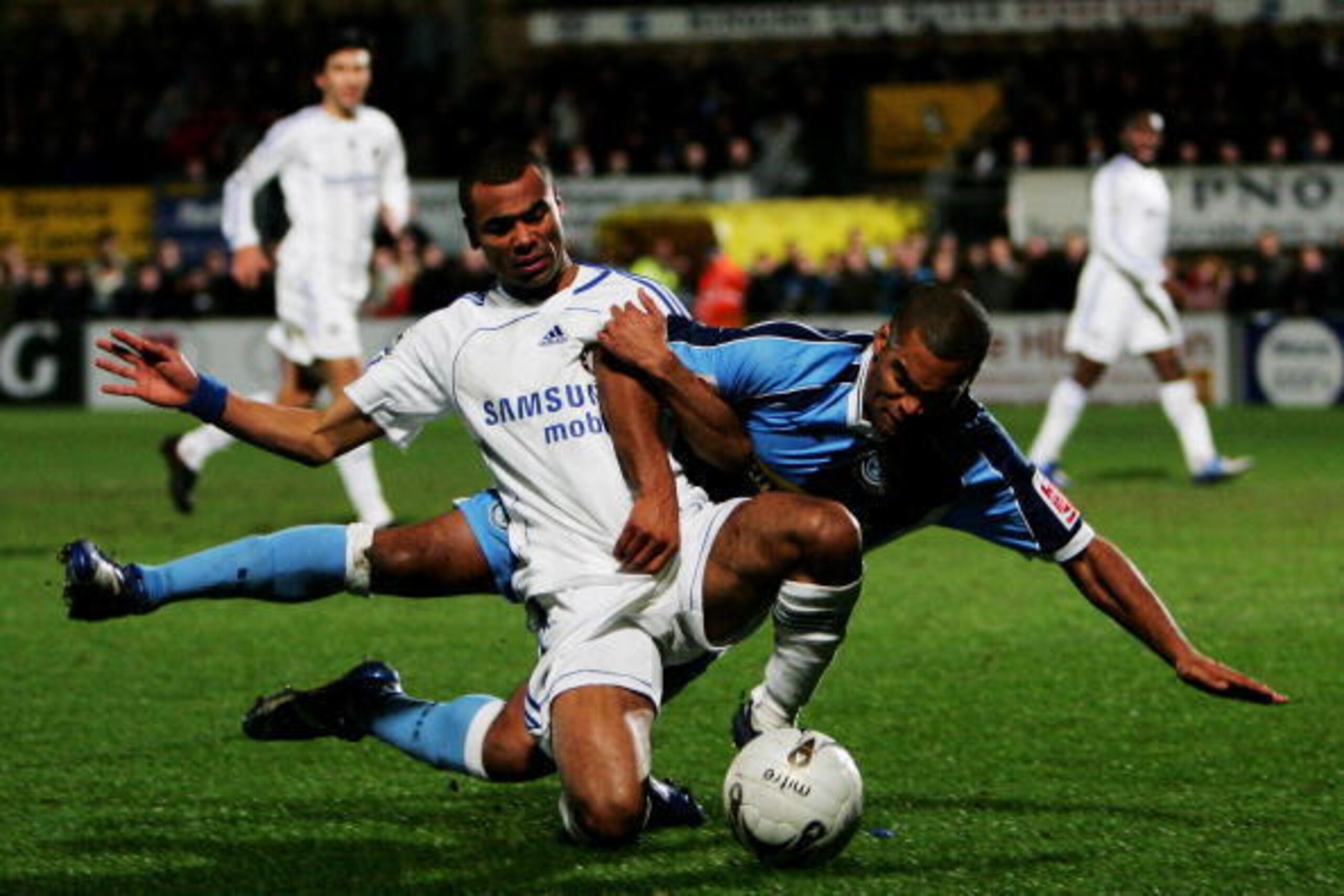 HIGH WYCOMBE, UNITED KINGDOM - JANUARY 10:  Jermaine Easter of Wycombe battles for the ball with Ashley Cole of Chelsea during the Carling Cup Semi Final 1st leg match between Wycombe Wanderers and Chelsea at Causeway Stadium on January 10, 2007 in High W