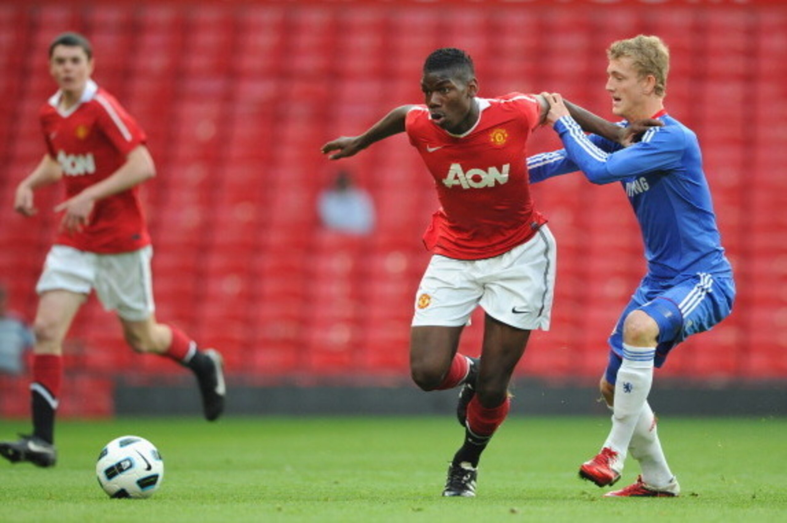 MANCHESTER, ENGLAND - APRIL 20:  Bobby Devyne of Chelsea battles Paul Pogba of Manchester United during the FA Youth Cup Semi Final 2nd Leg between Manchester United and Chelsea at Old Trafford on April 20, 2011 in Manchester, England.  (Photo by Michael 