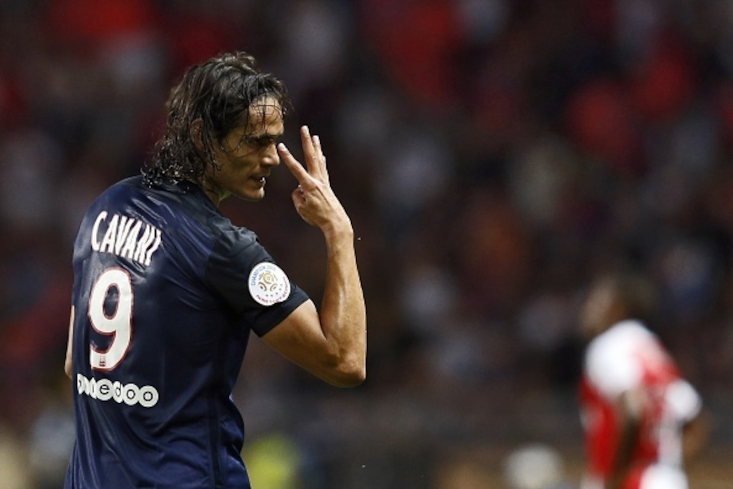 Paris Saint-Germain's Uruguayan forward Edinson Cavani celebrates after scoring his second goal during the French L1 football match Monaco (ASM) vs Paris Saint-Germain (PSG), on August 30, 2015 at the Louis II stadium in Monaco. AFP PHOTO / VALERY HACHE  