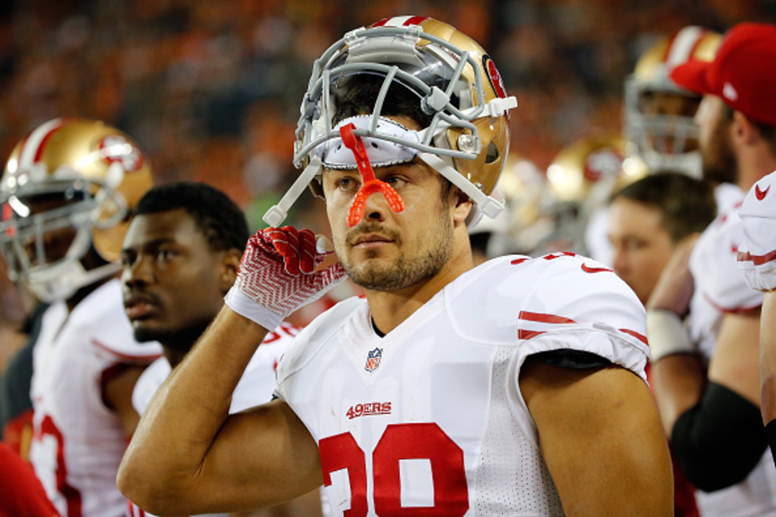DENVER, CO - AUGUST 29:  Jarryd Hayne #38 of the San Francisco 49ers looks on from the bench against the Denver Broncos during preseason action at Sports Authority Field at Mile High on August 29, 2015 in Denver, Colorado. The Broncos defeated the 49ers 1