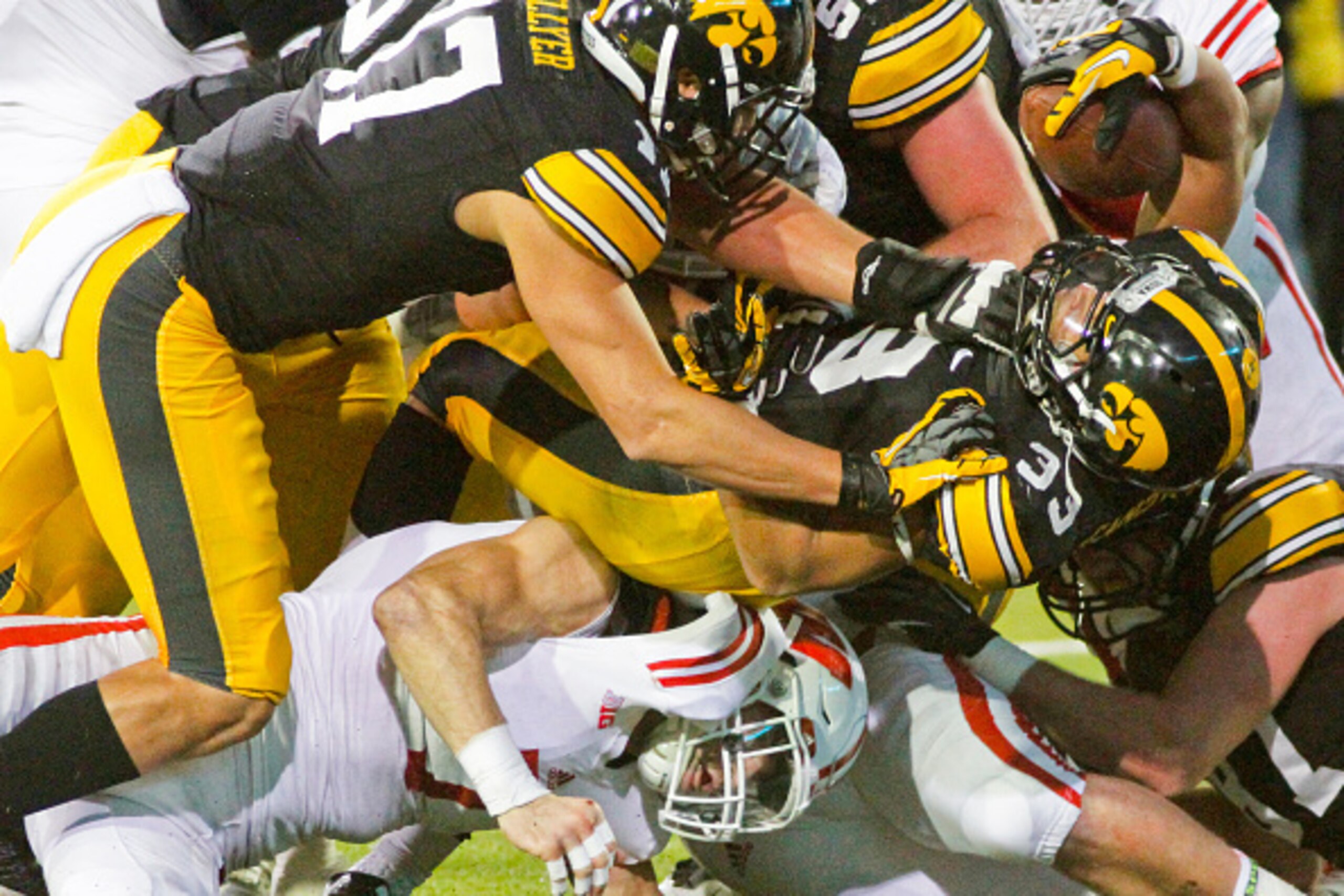 IOWA CITY, IA - NOVEMBER 22: Running back Jordan Canzeri #33 of the Iowa Hawkeyes scores on a two point conversion in the third quarter against the Wisconsin Badgers, on November 22, 2014 at Kinnick Stadium, in Iowa City, Iowa. (Photo by Matthew Holst/Get