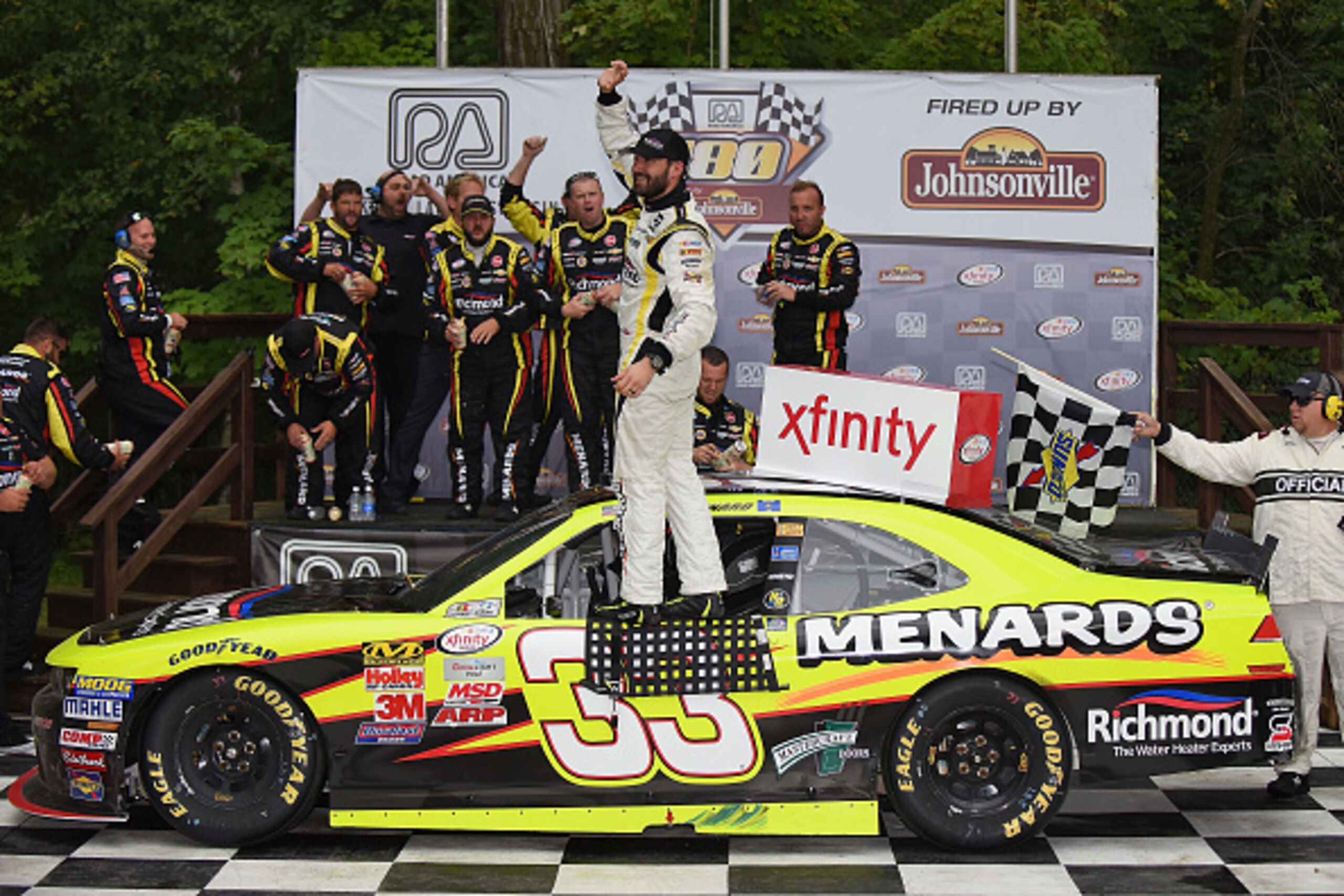 ELKHART LAKE, WI - AUGUST 29:  Paul Menard, driver of the #33 Richmond/Menards Chevrolet, celebrates after taking first in the Xfinity Series Road America 180 Fired Up by Johnsonville on at Road America on August 29, 2015 in Elkhart Lake, Wisconsin.  (Pho