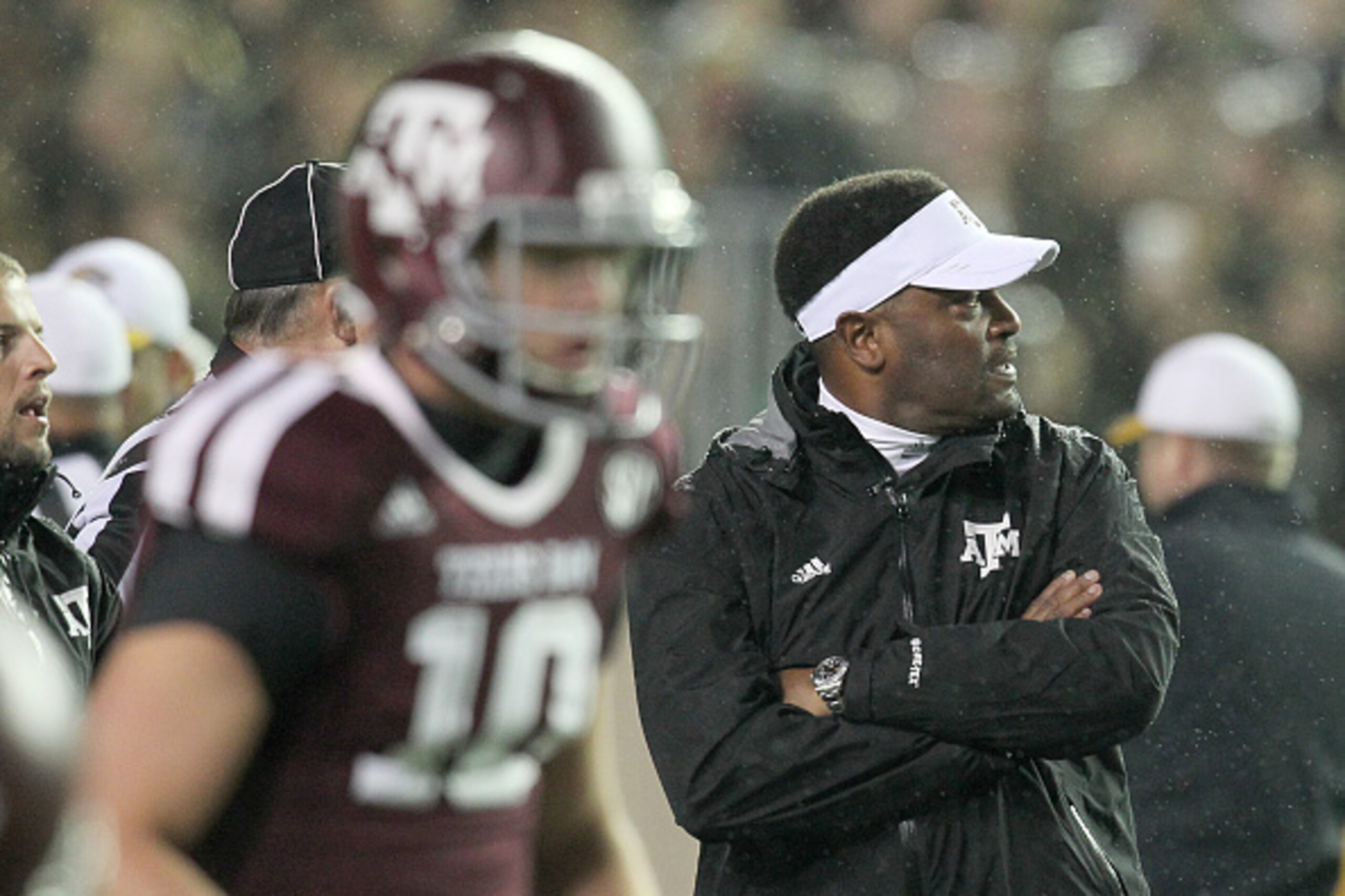 HOUSTON, TX - NOVEMBER 15: Head coach Kevin Sumlin of the Texas A&M Aggies wathces warm ups before the Texas A&M Aggies played the Missouri Tigers in a NCAA football game on November 15, 2014 at Kyle Field in College Station, Texas. Missouri Tigers won 34