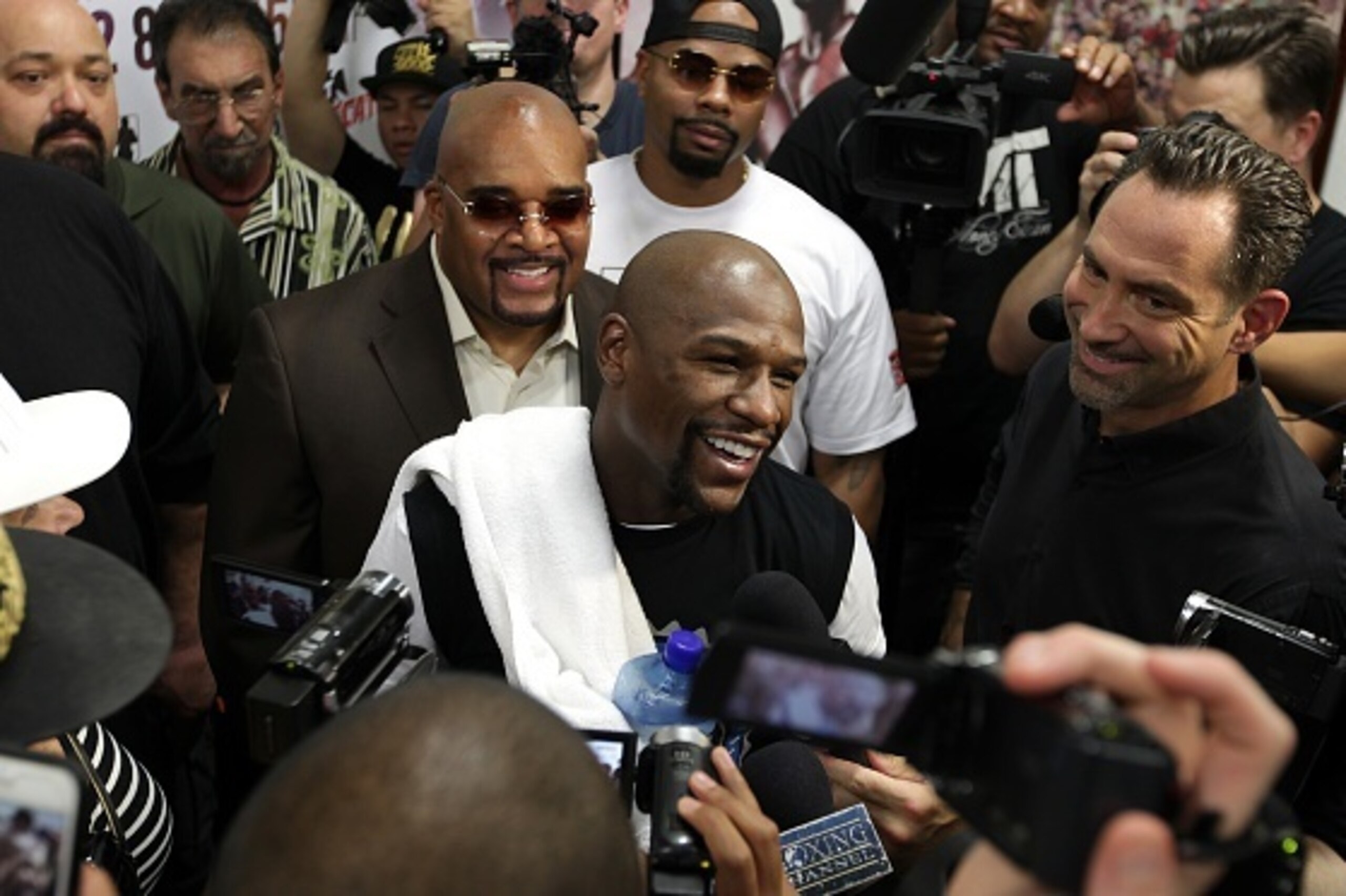 Floyd Mayweather Jr., responds to questions during his workout on August 26, 2015 in Las Vegas. Mayweather will meet Andre Berto in a welterweight title bout September 12, 2015, at the MGM Grand Garden Arena in Las Vegas.  AFP PHOTO/JOHN GURZINSKI        