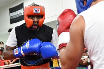 LAS VEGAS, NV - AUGUST 26:  Boxer Floyd Mayweather Jr. (L) spars with boxer Ramon Montano during a media workout at the Mayweather Boxing Club on August 26, 2015 in Las Vegas, Nevada. Mayweather will defend his WBC/WBA welterweight titles against Andre Be