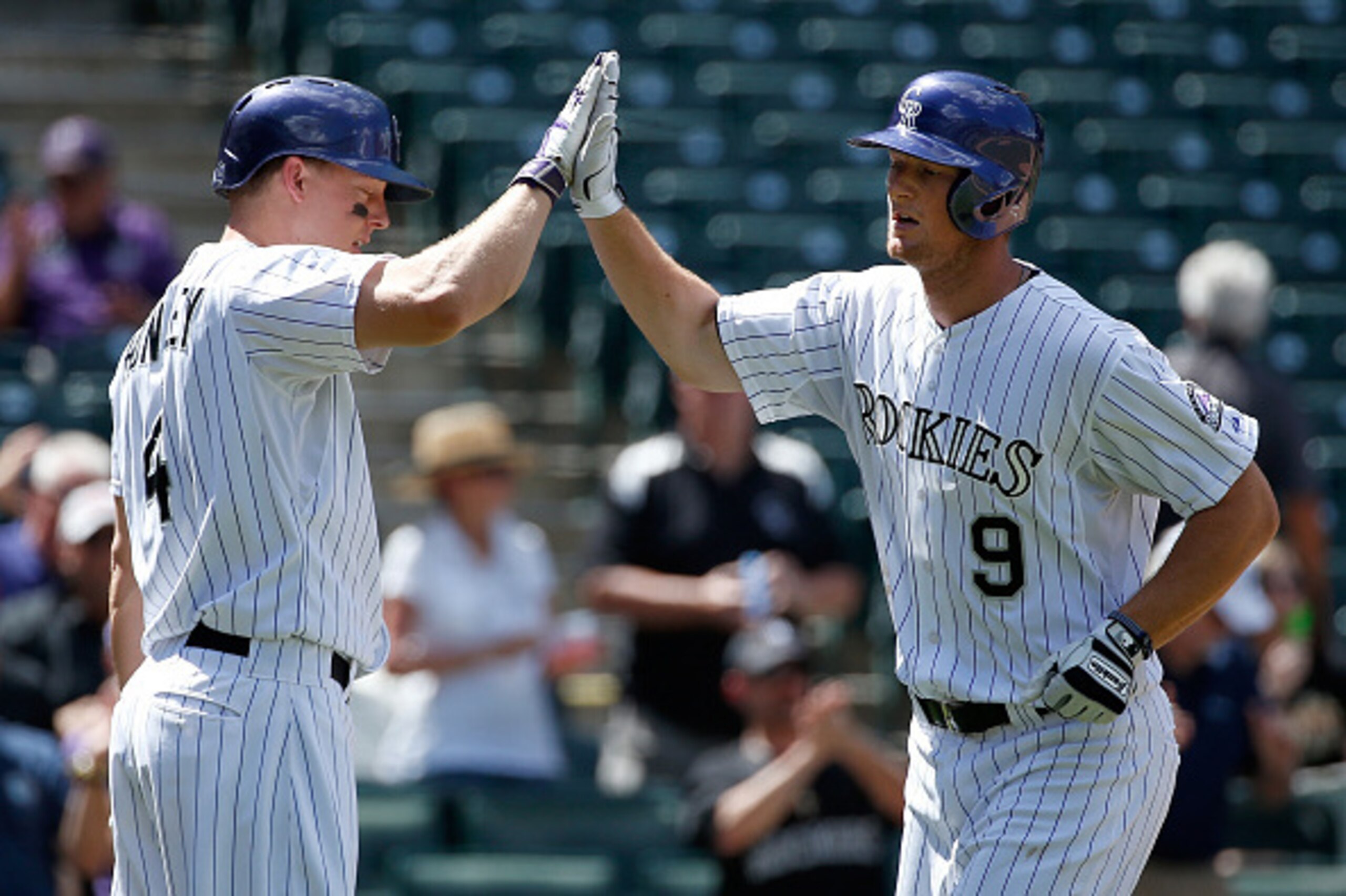 DENVER, CO - SEPTEMBER 01:  DJ LeMahieu #9 of the Colorado Rockies celebrates his solo home run off of Patrick Corbin #46 of the Arizona Diamondbacks with Nick Hundley #4 of the Colorado Rockies to tie the score 1-1 in the second inning at Coors Field on 