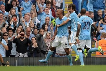 Manchester City's Belgian defender Vincent Kompany (3rd R) celebrates after scoring his team's second goal during the English Premier League football match between Manchester City and Chelsea at The Etihad stadium in Manchester, north-west England, on Aug