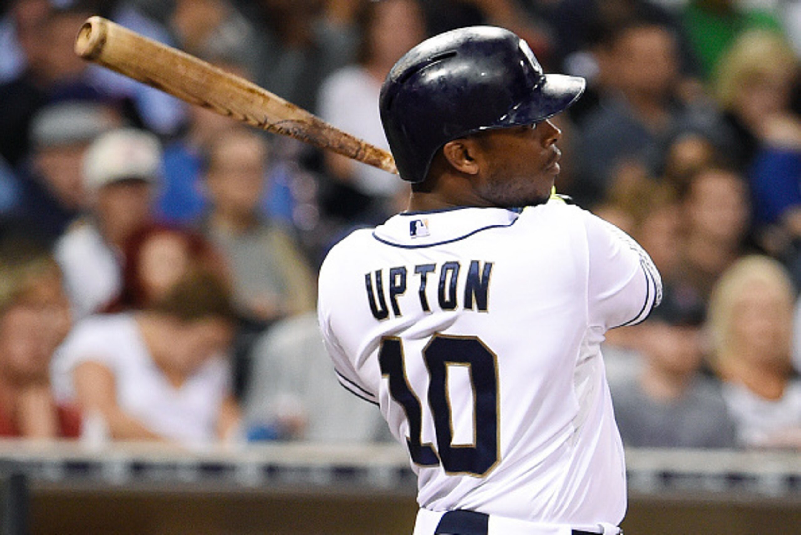 SAN DIEGO, CA - SEPTEMBER 2:  Justin Upton #10 of the San Diego Padres hits a double during the second inning of a baseball game against the Texas Rangers at Petco Park September, 2, 2015 in San Diego, California.  (Photo by Denis Poroy/Getty Images)