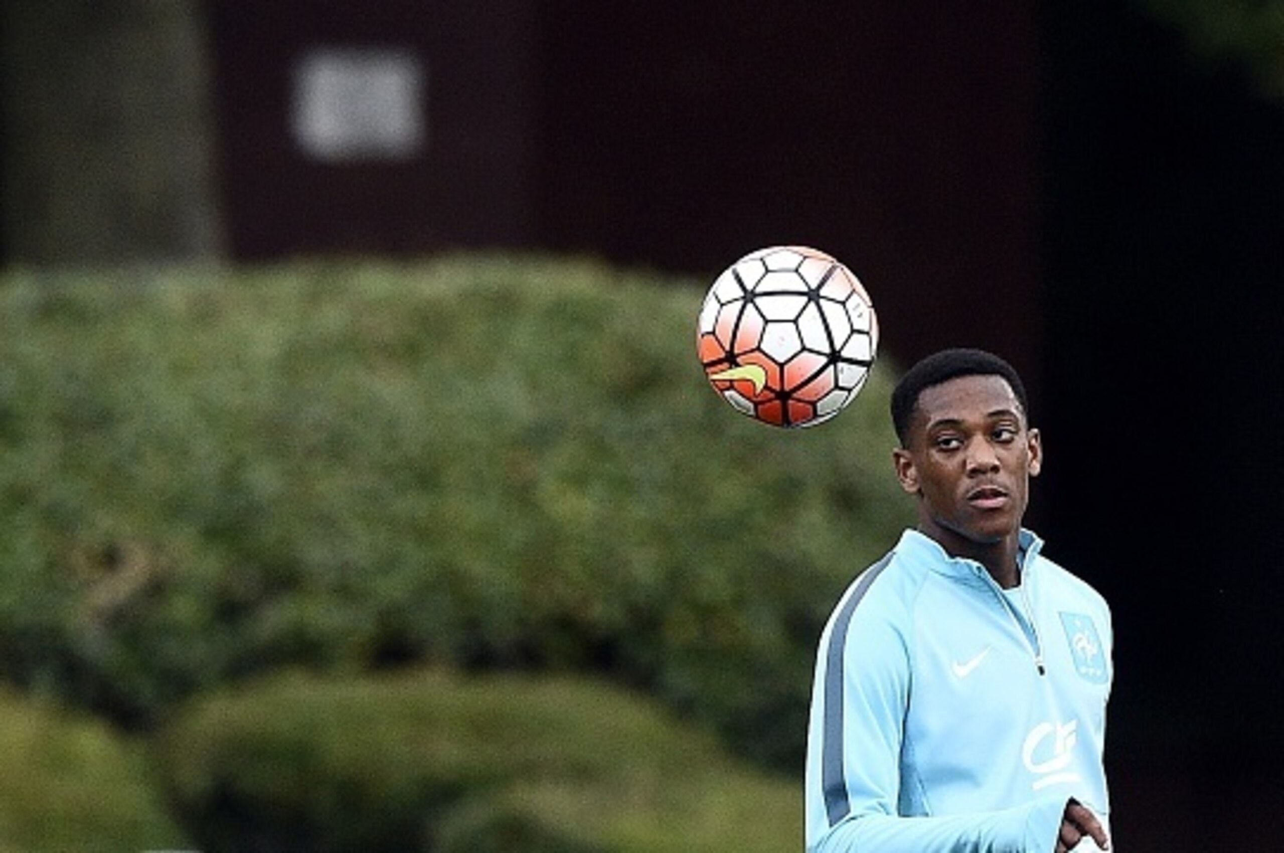 French forward Anthony Martial eyes the ball during a training session in Clairefontaine-en-Yvelines on September 2, 2015, two days ahead of the team friendly match against Portugal. AFP PHOTO / FRANCK FIFE        (Photo credit should read FRANCK FIFE/AFP