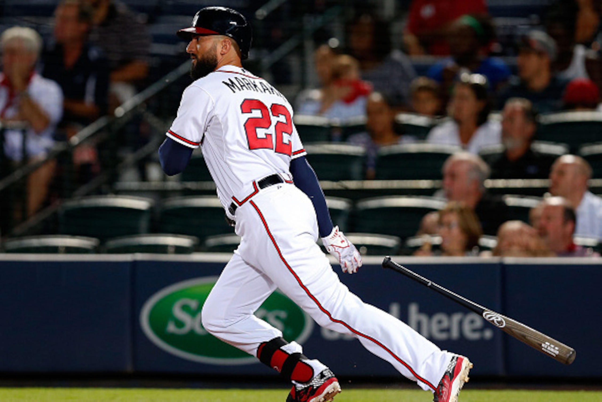ATLANTA, GA - AUGUST 25:  Nick Markakis #22 of the Atlanta Braves hits an RBI single in the fifth inning during the game against the Colorado Rockies at Turner Field on August 25, 2015 in Atlanta, Georgia.  (Photo by Mike Zarrilli/Getty Images)