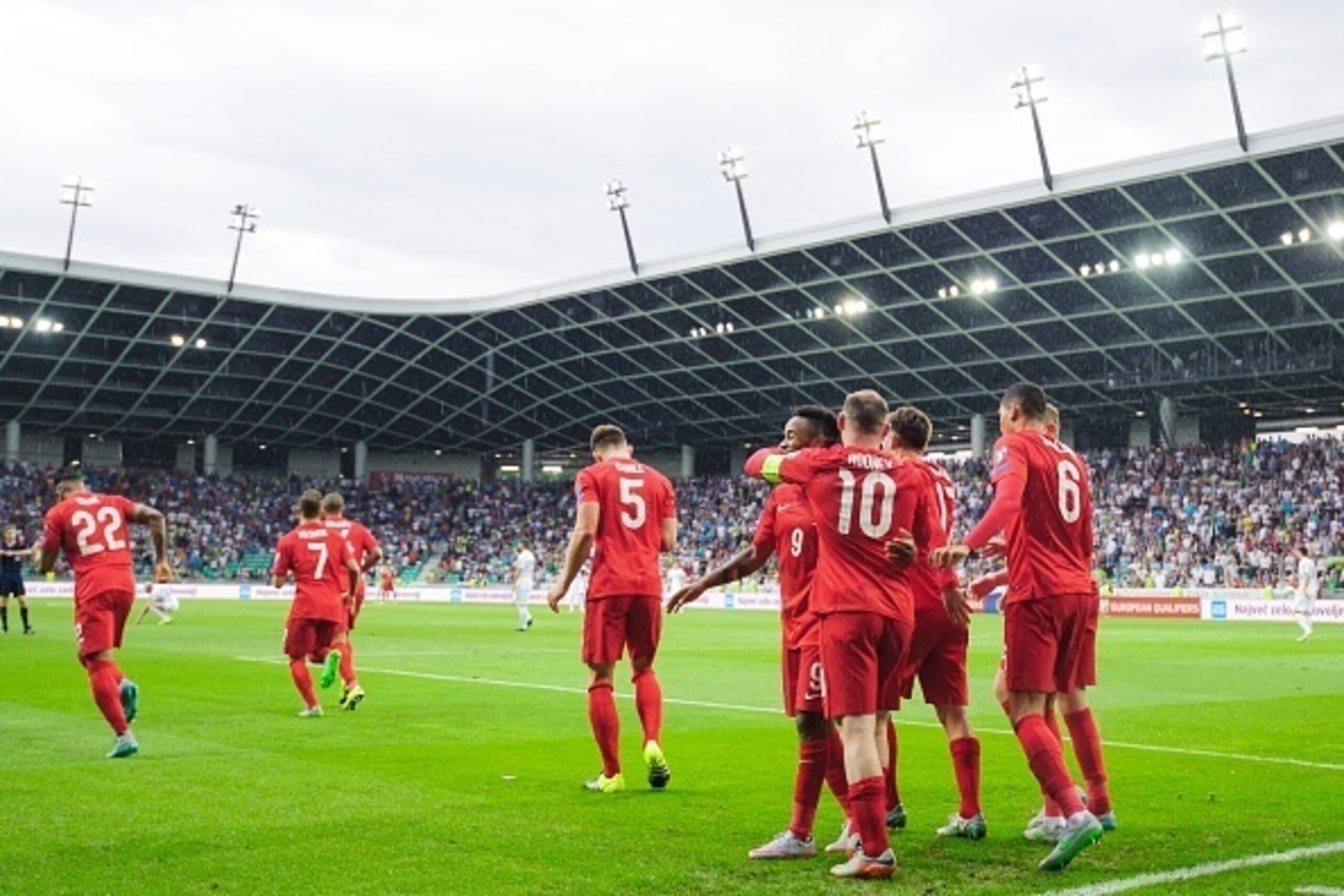 England's players celebrate after scoring a goal during the Euro 2016 qualifying football match between Slovenia and England at the Stadium Stozice in Ljubljana,  on June 14, 2015.
AFP PHOTO / Jure Makovec        (Photo credit should read Jure Makovec/AFP