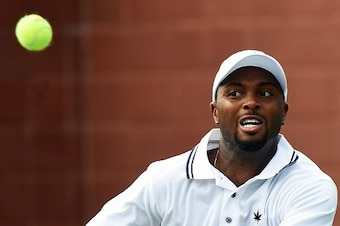 Donald Young of the US returns to Gilles Simon of France during their Men's Singles round 1 match at the US Open at USTA Billie Jean King National Tennis Center in New York on September 1, 2015. Young won 2-6, 4-6, 6-4, 6-4, 6-4. AFP PHOTO/JEWEL SAMAD    