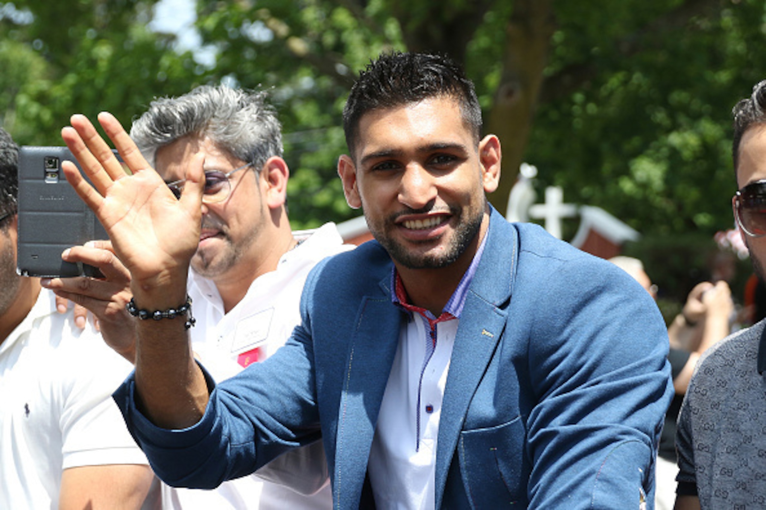 CANASTOTA, NY - JUNE 14: Boxer Amir Khan poses while riding in a car during the parade at the International Boxing Hall of Fame induction Weekend of Champions events on June 14, 2015 in Canastota, New York. (Photo by Alex Menendez/Getty Images) CANASTOTA, NY - JUNE 14: Boxer Amir Khan poses while riding in a car during the parade at the International Boxing Hall of Fame induction Weekend of Champions events on June 14, 2015 in Canastota, New York. (Photo by Alex Menendez/Getty Images)