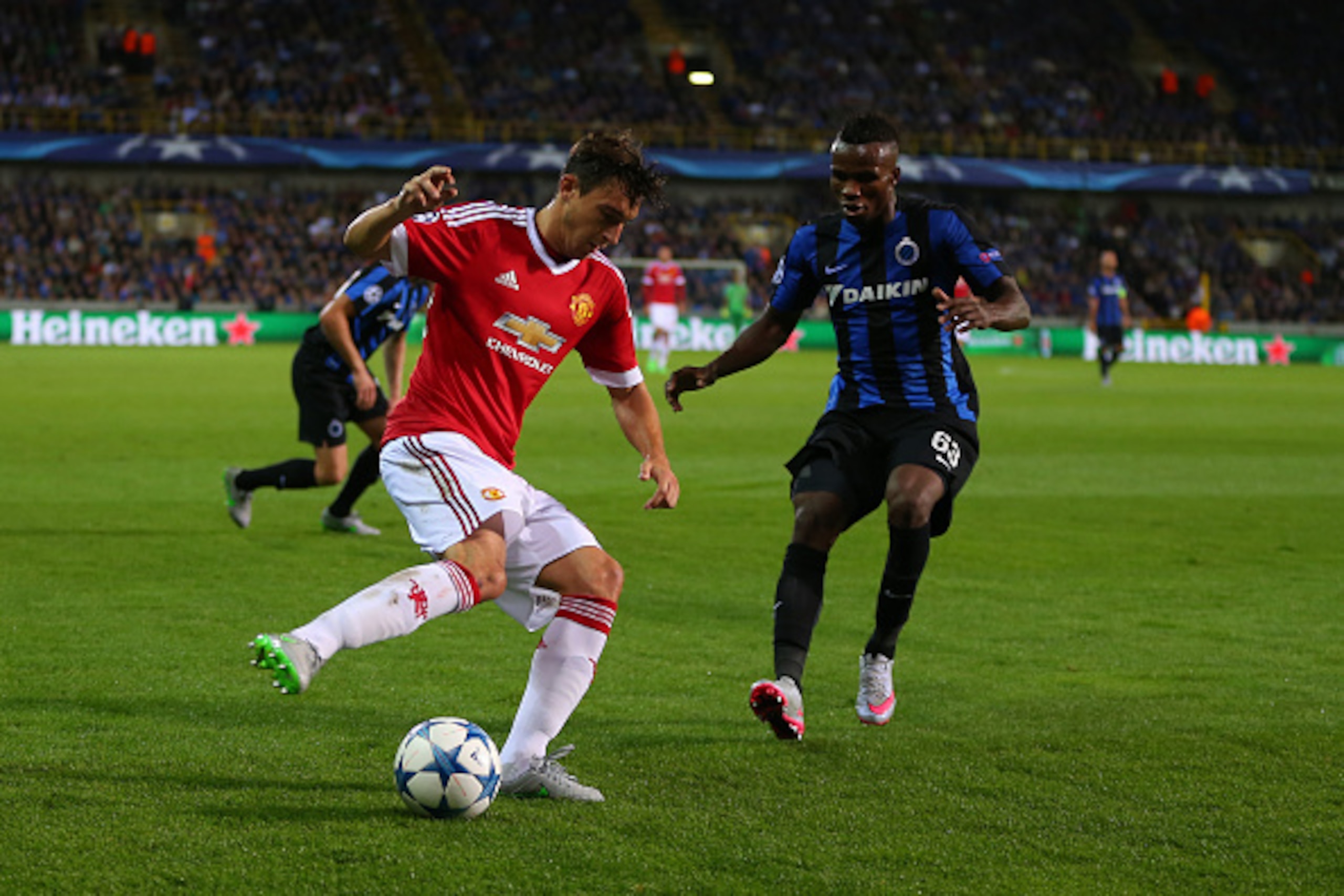 BRUGGE, BELGIUM - AUGUST 26: Matteo Darmian of Manchester United and Boli Bolingoli Mbombo of Brugge during the UEFA Champions League Qualifying Round Play Off Second Leg between Club Brugge and Manchester United on August 26, 2015 in Brugge, Belgium. (Ph BRUGGE, BELGIUM - AUGUST 26: Matteo Darmian of Manchester United and Boli Bolingoli Mbombo of Brugge during the UEFA Champions League Qualifying Round Play Off Second Leg between Club Brugge and Manchester United on August 26, 2015 in Brugge, Belgium. (Ph