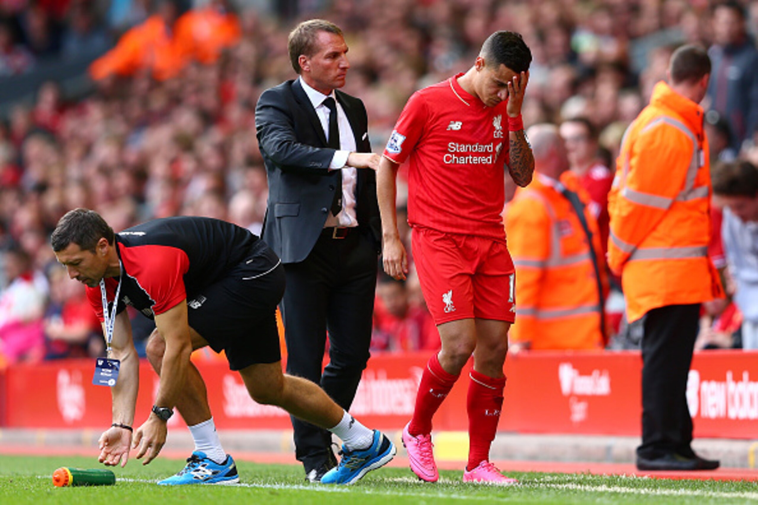 LIVERPOOL, ENGLAND - AUGUST 29:  Philippe Coutinho of Liverpool is consoled by Brendan Rodgers, manager of Liverpool after receiving a red card during the Barclays Premier League match between Liverpool and West Ham United at Anfield on August 29, 2015 in