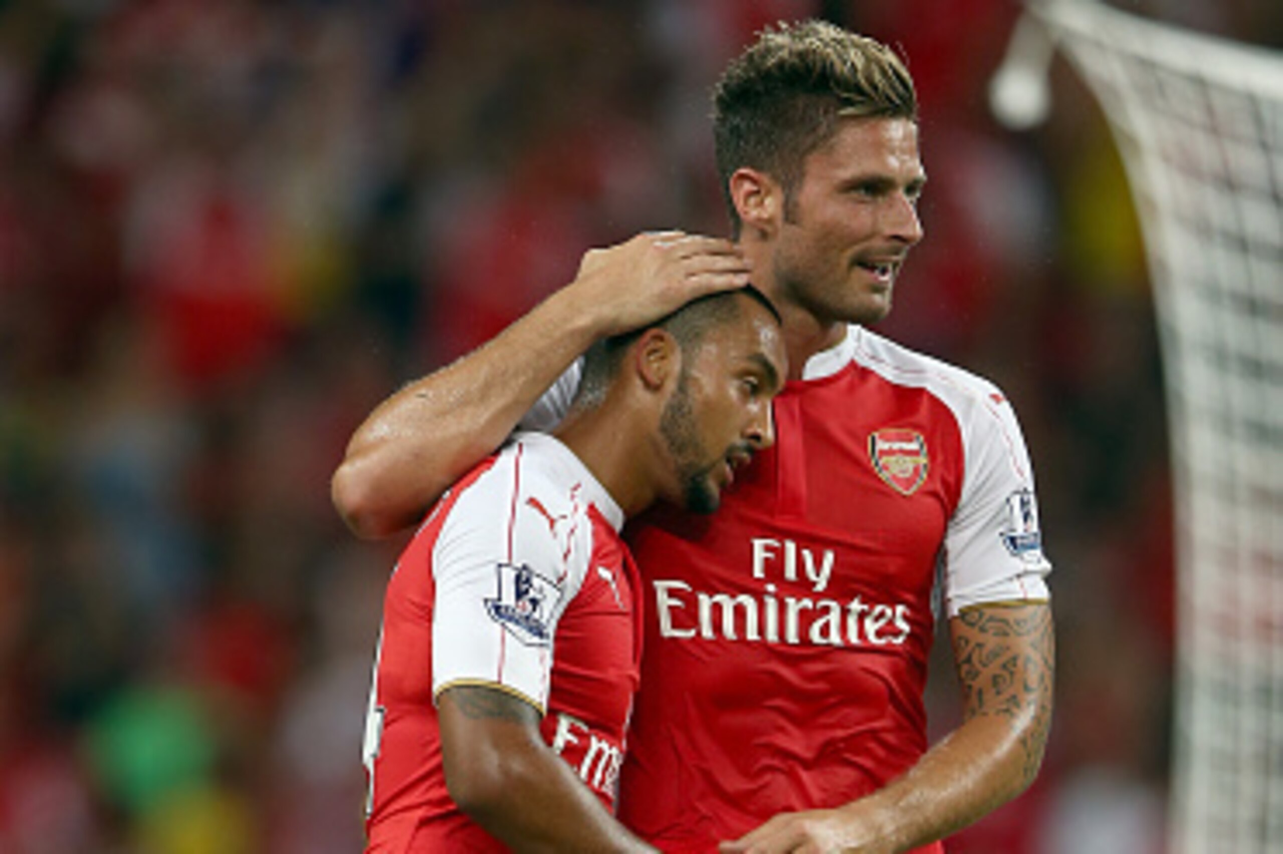 SINGAPORE - JULY 18:  Theo Walcott of Arsenal celebrates with Olivier Giroud after scoring the 1st goal against Everton during the Barclays Asia Trophy final match between Arsenal and Everton at the National Stadium on July 18, 2015 in Singapore.  (Photo 
