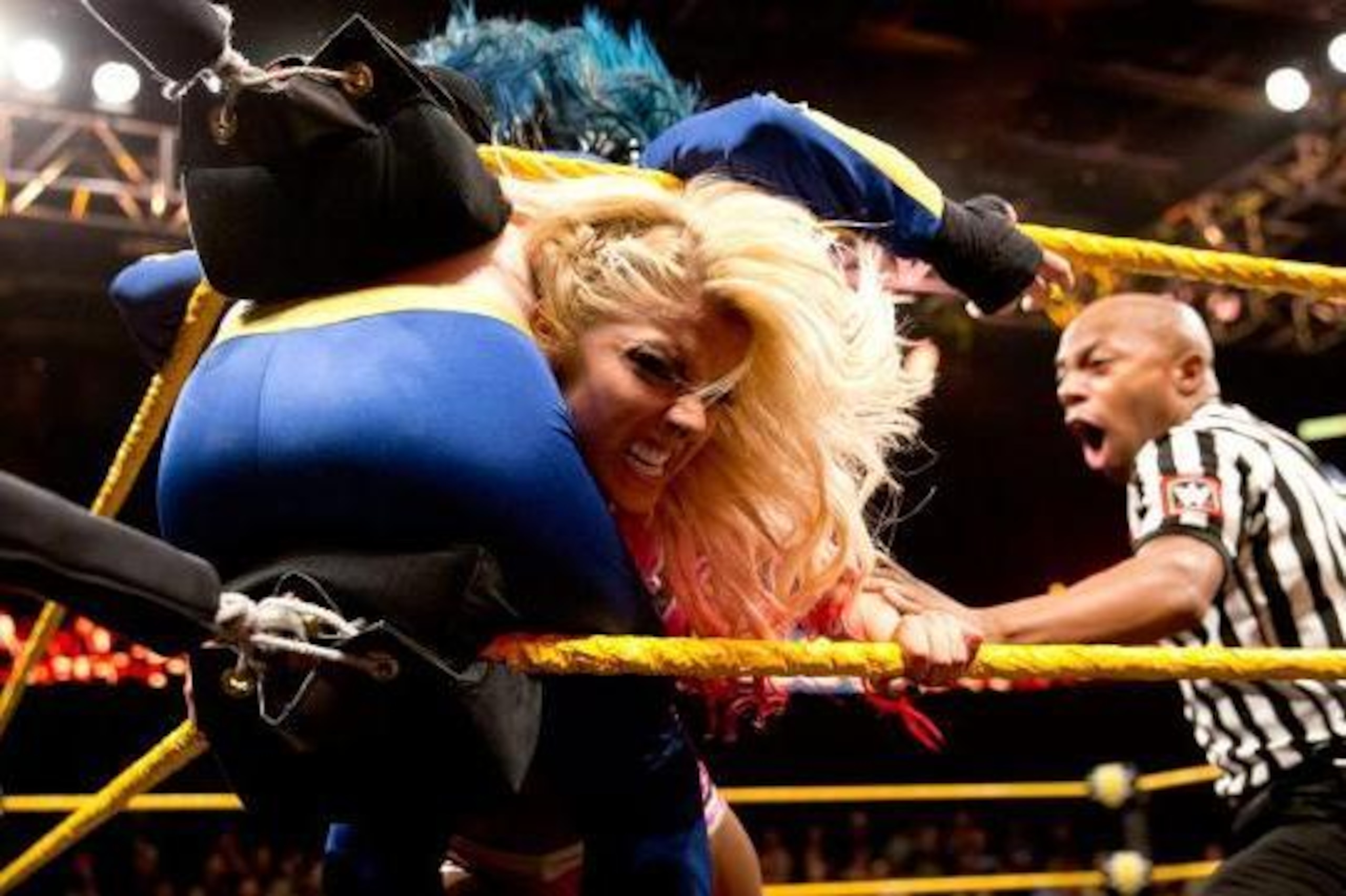 Alexa Bliss on the attack against Blue Pants. Alexa Bliss on the attack against Blue Pants.