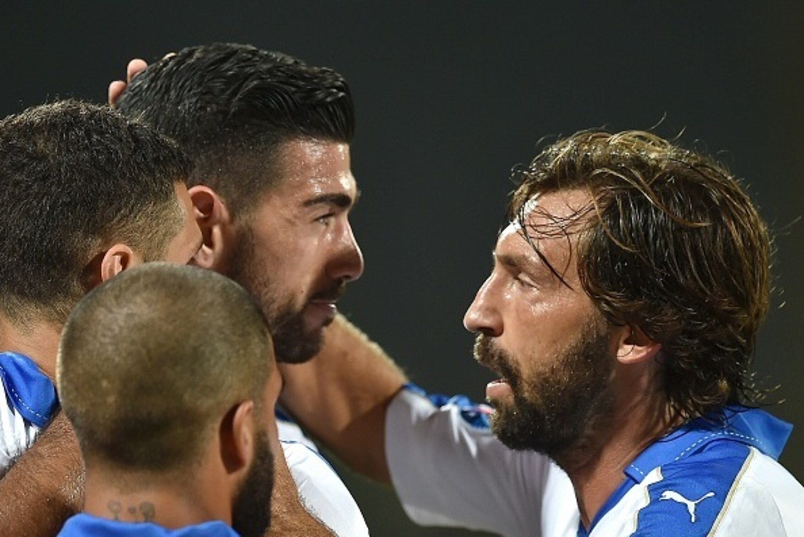 Italy's forward Graziano Pelle (C) celebrates with Italys' midfielder Andrea Pirlo (R) afte scoring during the Euro 2016 group H qualifying football match between Italy and Malta on September 3, 2015 at the Artemio Franchi stadium in Florence. AFP PHOTO /