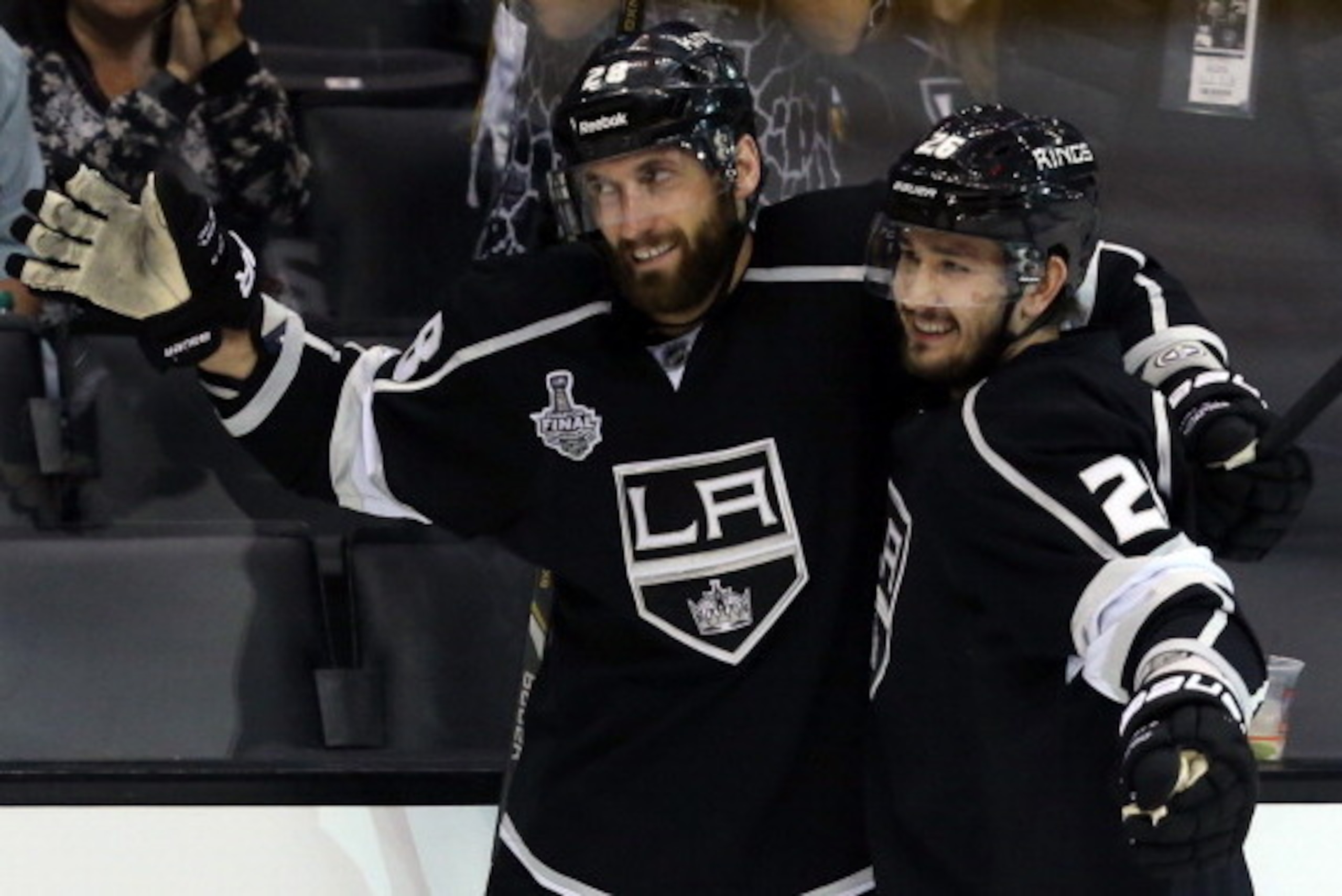 LOS ANGELES, CA - JUNE 07:  Jarret Stoll #28 of the Los Angeles Kings celebrates with teammate Slava Voynov #26 after scoring a goal against Henrik Lundqvist #30 of the New York Rangers in the second period during Game Two of the 2014 NHL Stanley Cup Fina