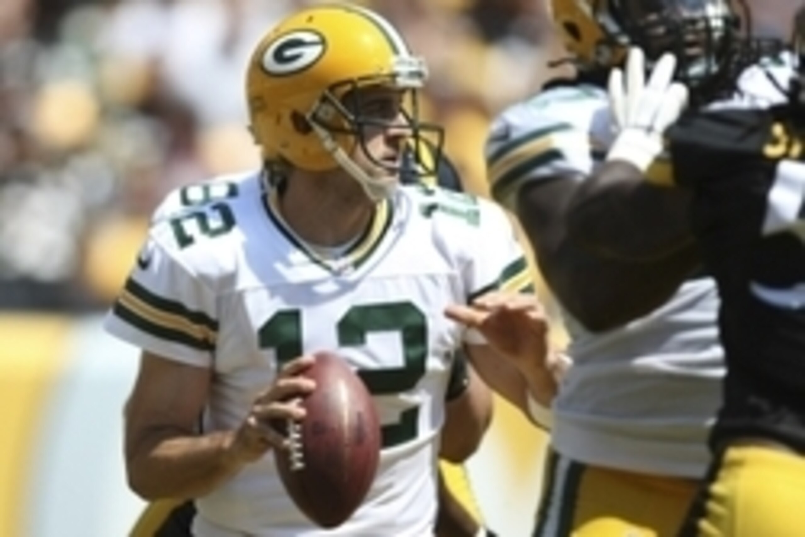 Aug 23, 2015; Pittsburgh, PA, USA; Green Bay Packers quarterback Aaron Rodgers (12) looks to throw a pass against the Pittsburgh Steelers during the first half at Heinz Field. Mandatory Credit: Jason Bridge-USA TODAY Sports