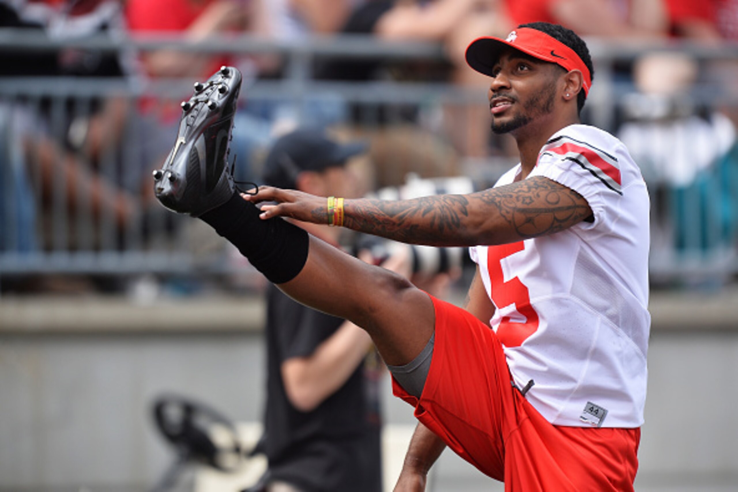 COLUMBUS, OH - APRIL 18:  Quarterback Braxton Miller #5 of the Ohio State Buckeyes stretches on the sideline during the annual Ohio State Spring Game at Ohio Stadium on April 18, 2015 in Columbus, Ohio. Miller is recovering from an injury.   (Photo by Jam