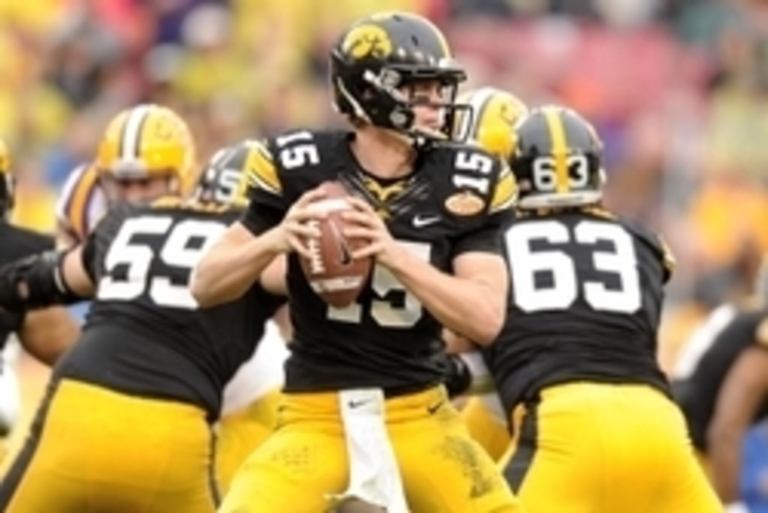 Jan 1, 2014; Tampa, Fl, USA; Iowa Hawkeyes quarterback Jake Rudock (15) throws a pass against LSU Tigers during the first half at Raymond James Stadium. Mandatory Credit: Steve Mitchell-USA TODAY Sports