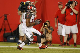 TAMPA, FL - AUGUST 29: Running back Doug Martin #22 of the Tampa Bay Buccaneers runs in the end zone during the preseason game between the Tampa Bay Buccaneers and the Cleveland Browns at Raymond James Stadium on August 29, 2015 in Tampa, Florida. (Photo 