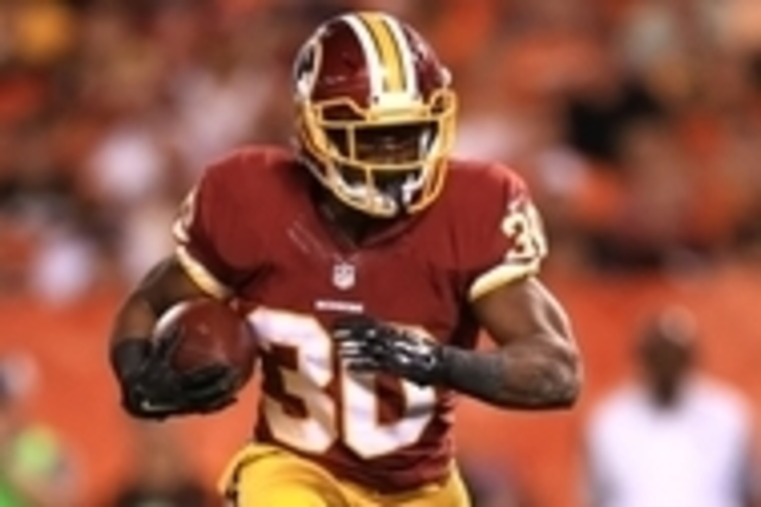 Aug 13, 2015; Cleveland, OH, USA; Washington Redskins running back Trey Williams (30) runs the ball during the fourth quarter of preseason NFL football game against the Cleveland Browns at FirstEnergy Stadium. Mandatory Credit: Andrew Weber-USA TODAY Spor