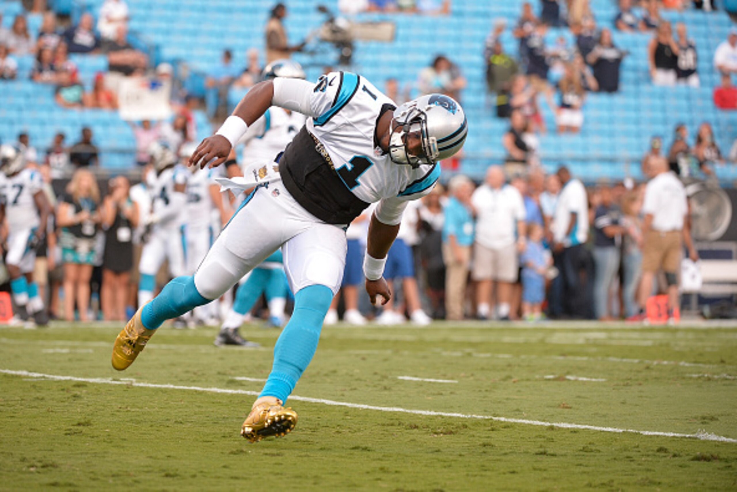 CHARLOTTE, NC - AUGUST 28:  Cam Newton #1 of the Carolina Panthers takes the field for their preseason NFL game against the New England Patriots at Bank of America Stadium on August 28, 2015 in Charlotte, North Carolina.  (Photo by Grant Halverson/Getty I