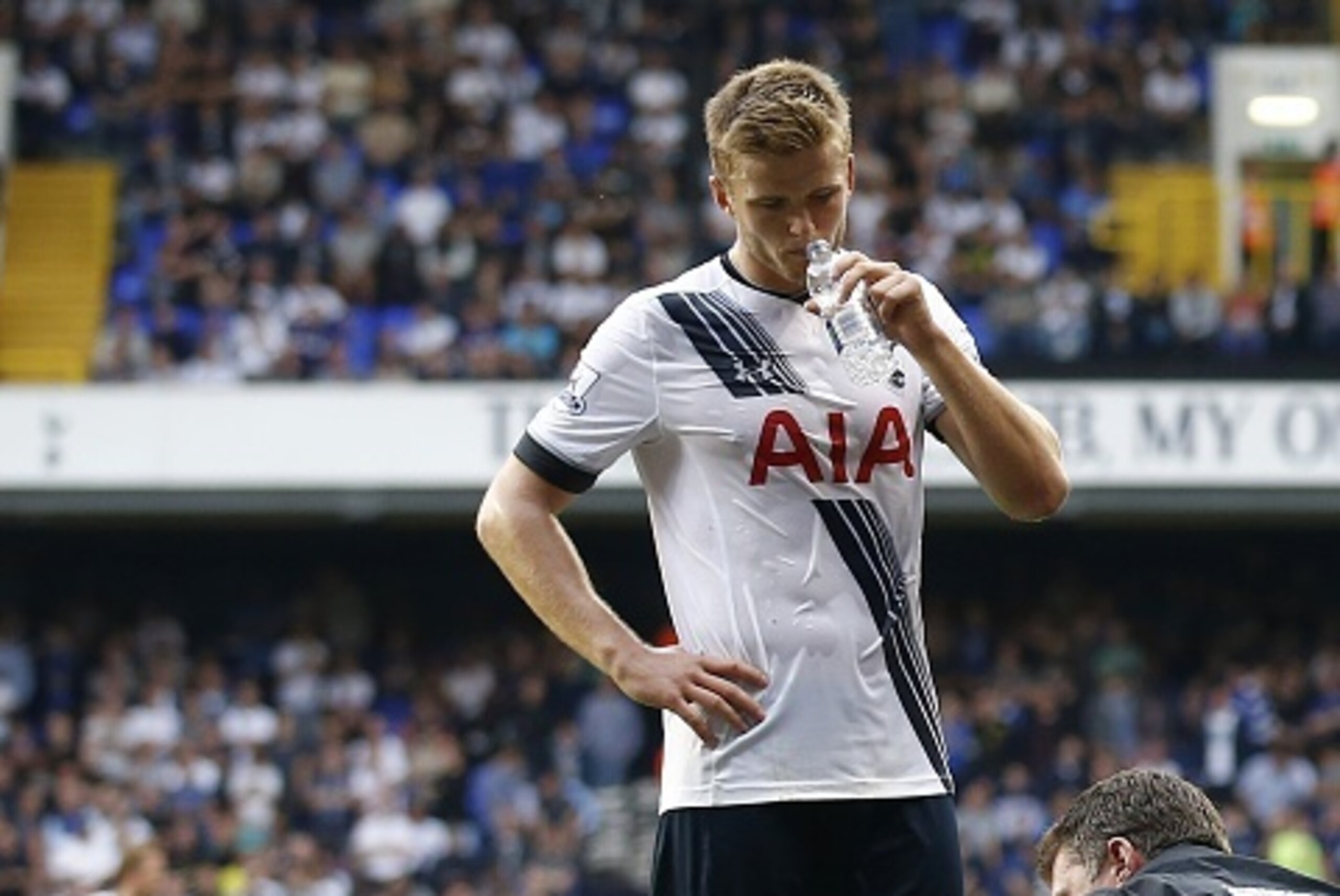 Everton's English midfielder Tom Cleverley (Below L) lies injured following a challenge by Tottenham Hotspur's English defender Eric Dier (Top) during the English Premier League football match between Tottenham Hotspur and Everton at White Hart Lane in no
