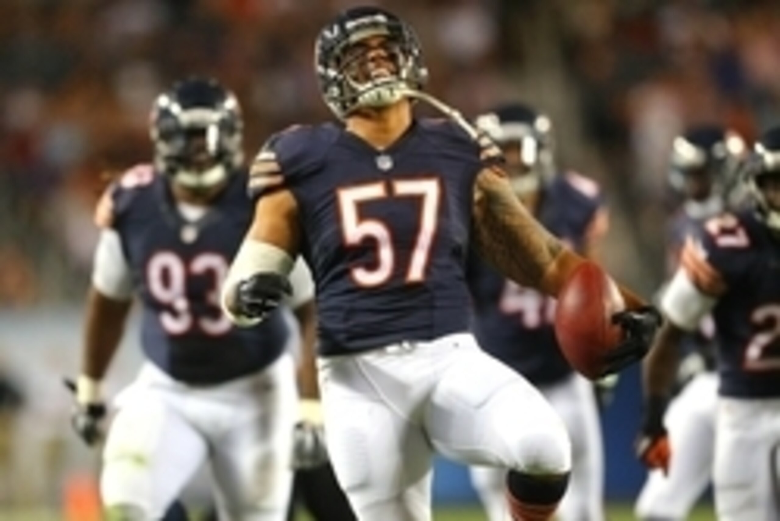 Aug 13, 2015; Chicago, IL, USA; Chicago Bears outside linebacker John Timu (57) celebrates making an interception during the second half of a preseason NFL football game against the Miami Dolphins at Soldier Field. Chicago won 27-10. Mandatory Credit: Den