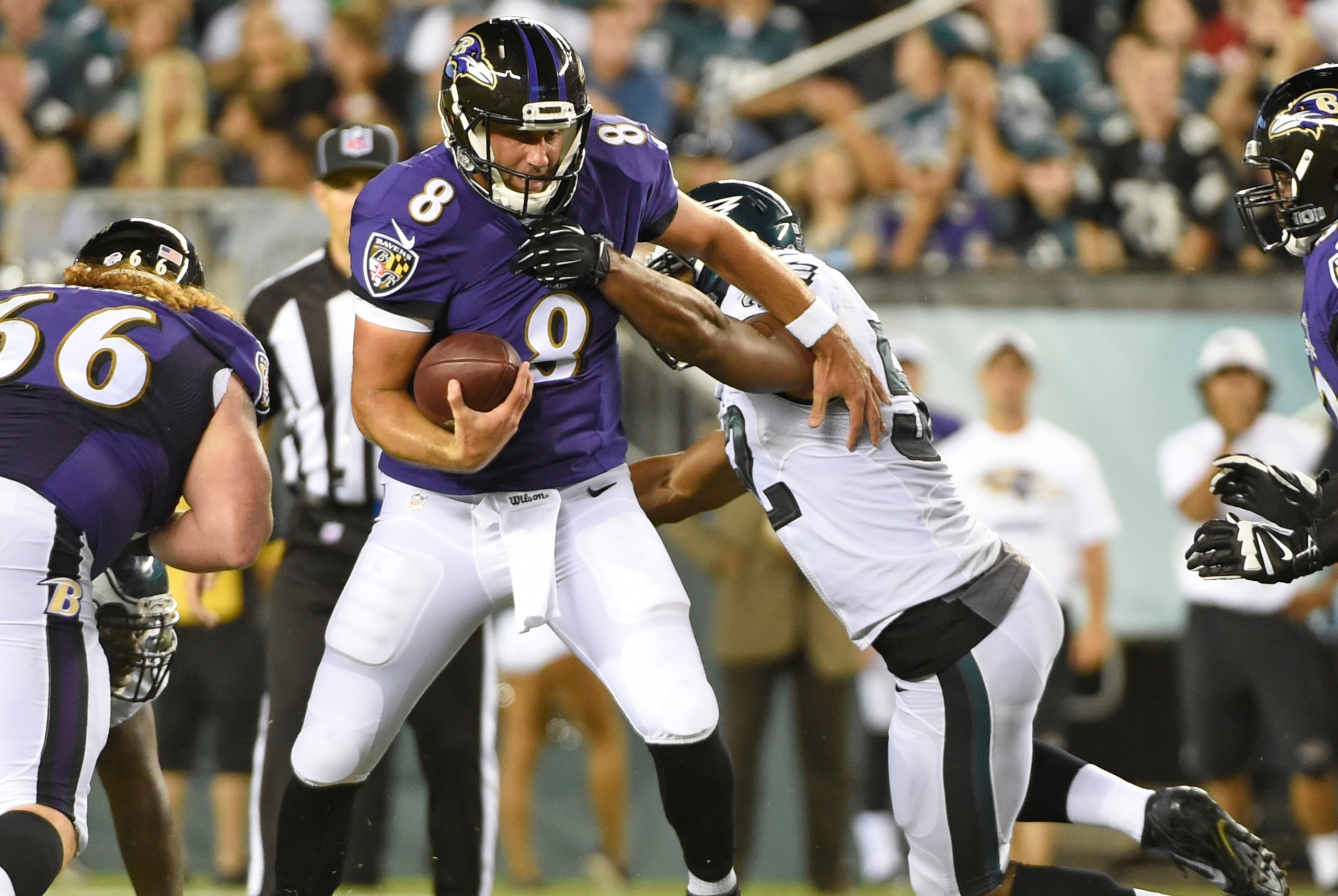 Aug 22, 2015; Philadelphia, PA, USA; Baltimore Ravens quarterback Matt Schaub (8) breaks a tackle attempt by Philadelphia Eagles linebacker Brad Jones (52) during the first half at Lincoln Financial Field. Mandatory Credit: Eric Hartline-USA TODAY Sports