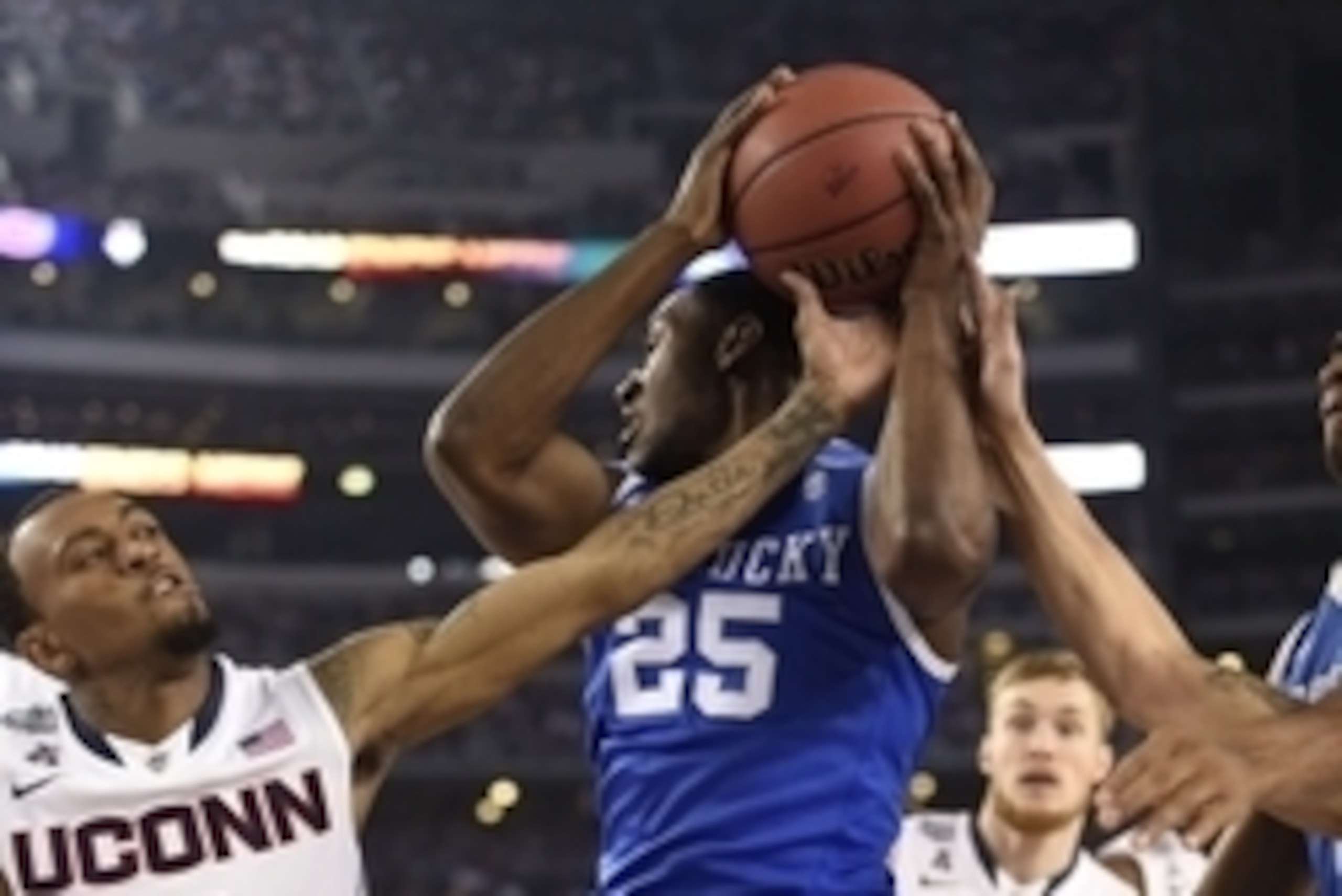 Apr 7, 2014; Arlington, TX, USA; Connecticut Huskies guard Ryan Boatright (11) reaches for the ball held by Kentucky Wildcats guard Dominique Hawkins (25) in the first half during the championship game of the Final Four in the 2014 NCAA Mens Division I Ch