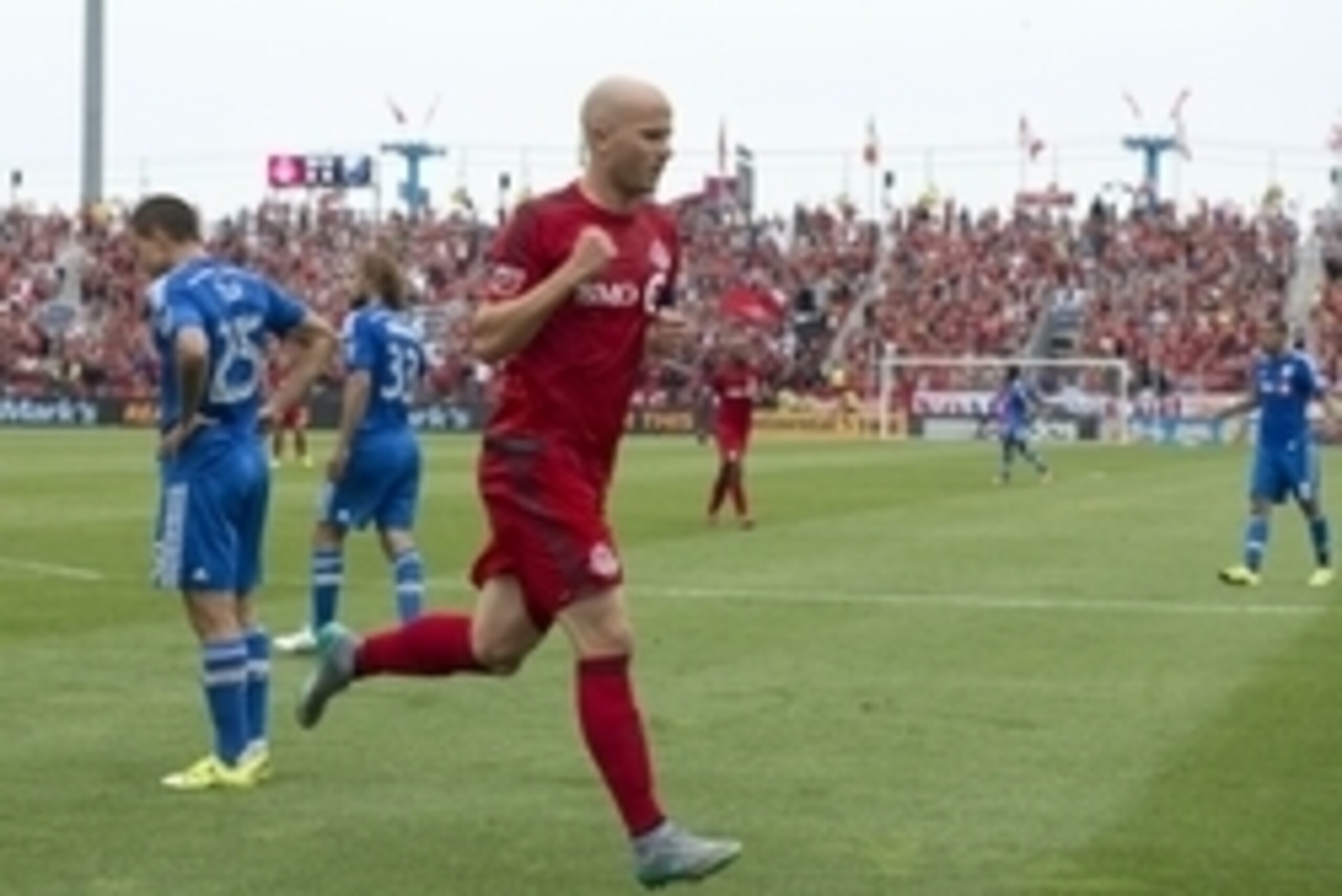 Aug 29, 2015; Toronto, Ontario, CAN; Toronto FC midfielder Michael Bradley (4) celebrates after scoring a goal during the first half in a game against the Montreal Impact at BMO Field. Mandatory Credit: Nick Turchiaro-USA TODAY Sports