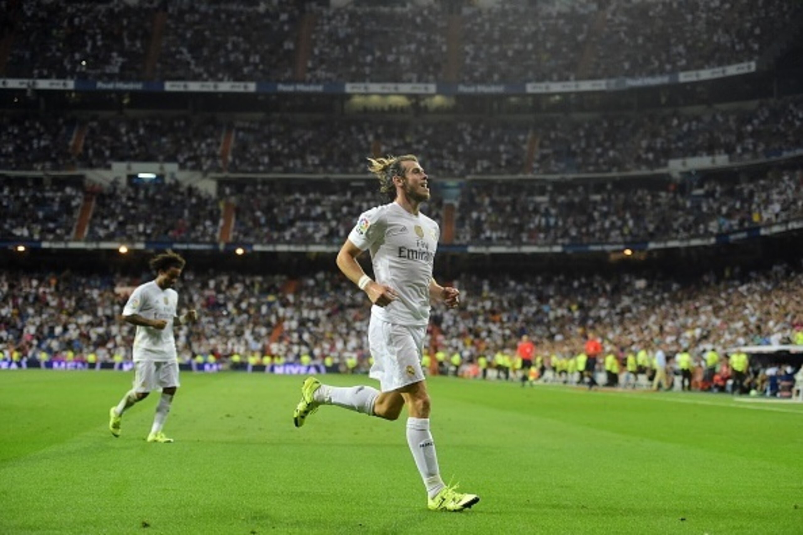Real Madrid's Welsh forward Gareth Bale celebrates after scoring his second goal during the Spanish league football match Real Madrid CF vs Real Betis Balompie at the Santiago Bernabeu stadium in Madrid on August 29, 2015.   AFP PHOTO/ PIERRE-PHILIPPE MAR