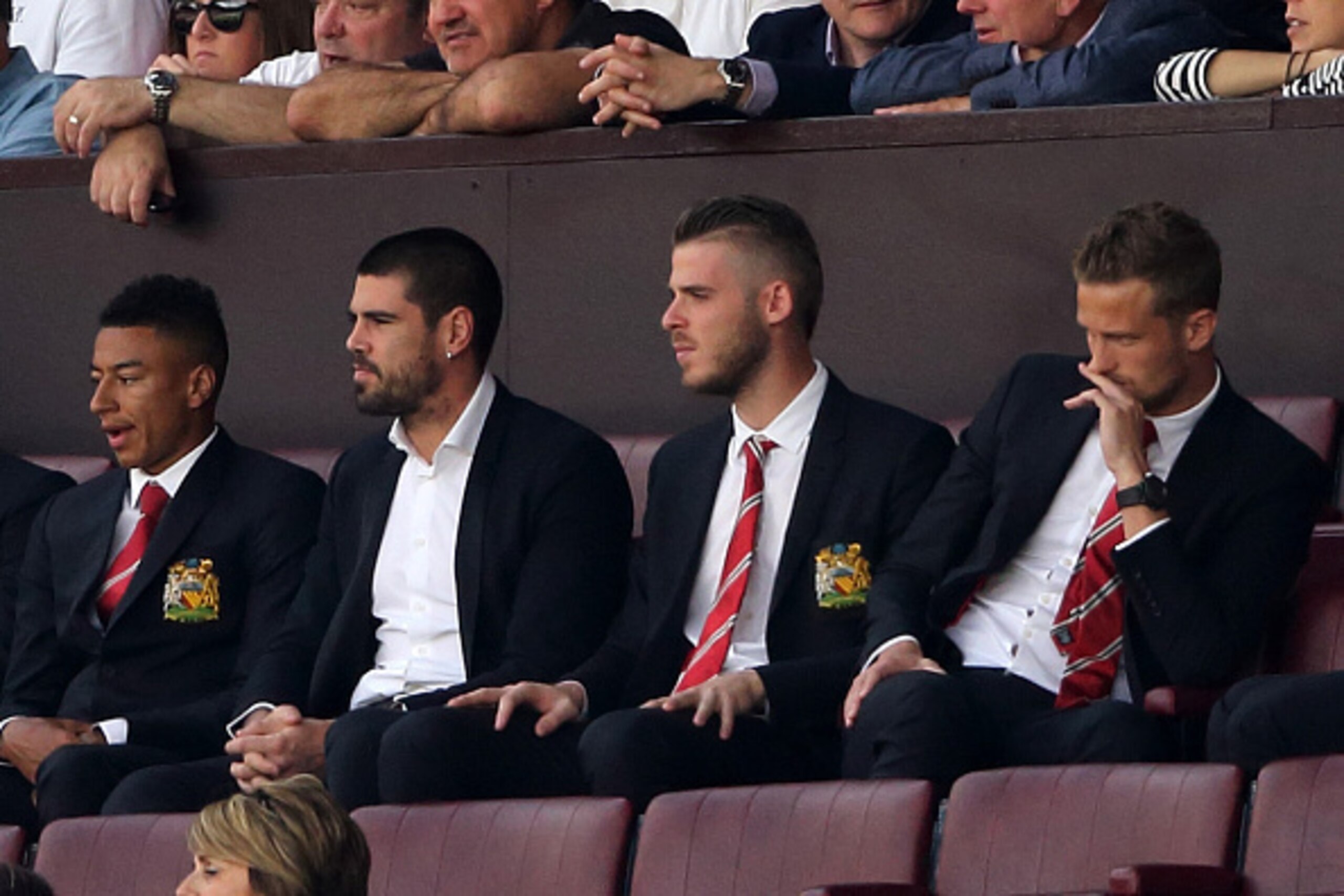 MANCHESTER, ENGLAND - AUGUST 08:  Goalkeepers Victor Valdes and David De Gea of Manchester United watch the game from the stands during the Barclays Premier League match between Manchester United and Tottenham Hotspur at Old Trafford on August 08, 2015 in