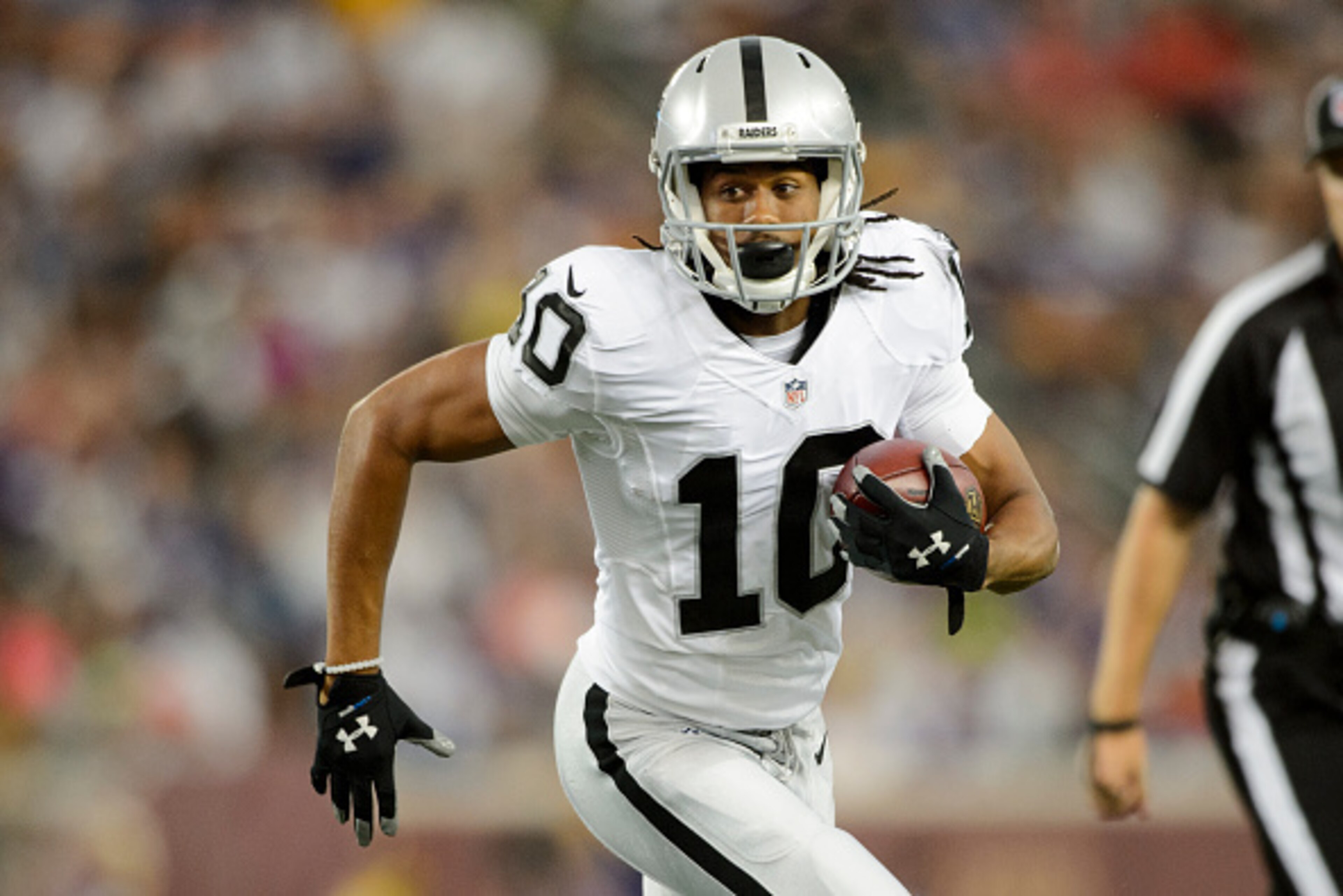 MINNEAPOLIS, MN - AUGUST 22: Seth Roberts #10 of the Oakland Raiders carries the ball against the Minnesota Vikings during the preseason game on August 22, 2014 at TCF Bank Stadium in Minneapolis, Minnesota. The Vikings defeated the Raiders 20-12. (Photo 