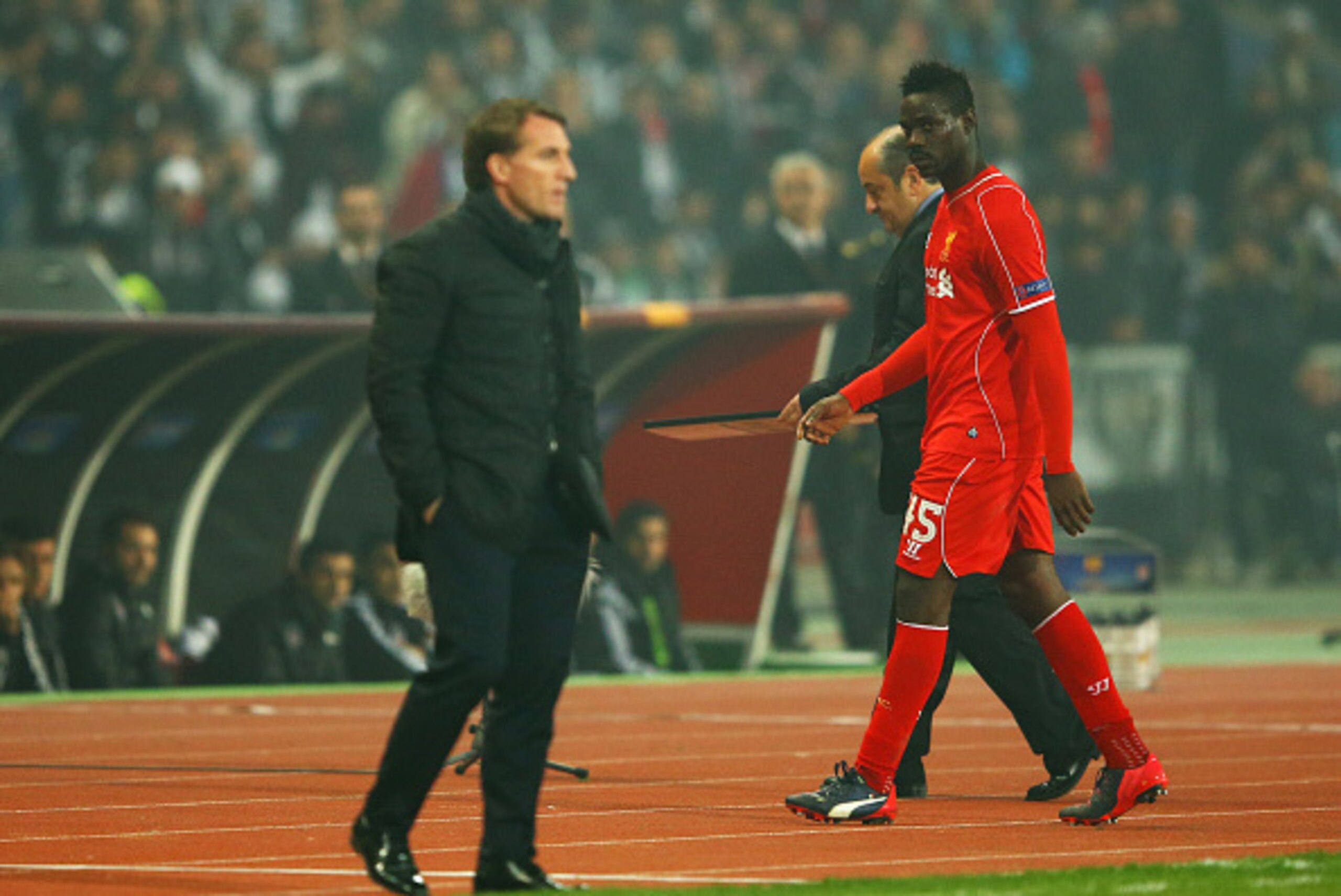 ISTANBUL, TURKEY - FEBRUARY 26:  Mario Balotelli of Liverpool looks across as Brendan Rodgers manager of Liverpool as he is substituted during the UEFA Europa League Round of 32 second leg match between Besiktas JK and Liverpool FC on February 26, 2015 in