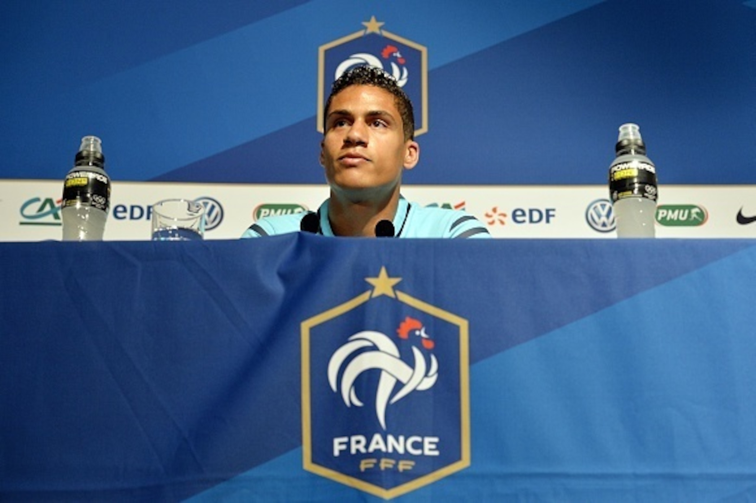 French defender Raphael Varane takes part in a press conference on June 5, 2015 in Clairefontaine-en-Yvelines, two days prior to the friendly football match France vs Belgium at the Stade-de-France in Saint-Denis outside Paris.     AFP PHOTO / LOIC VENANC