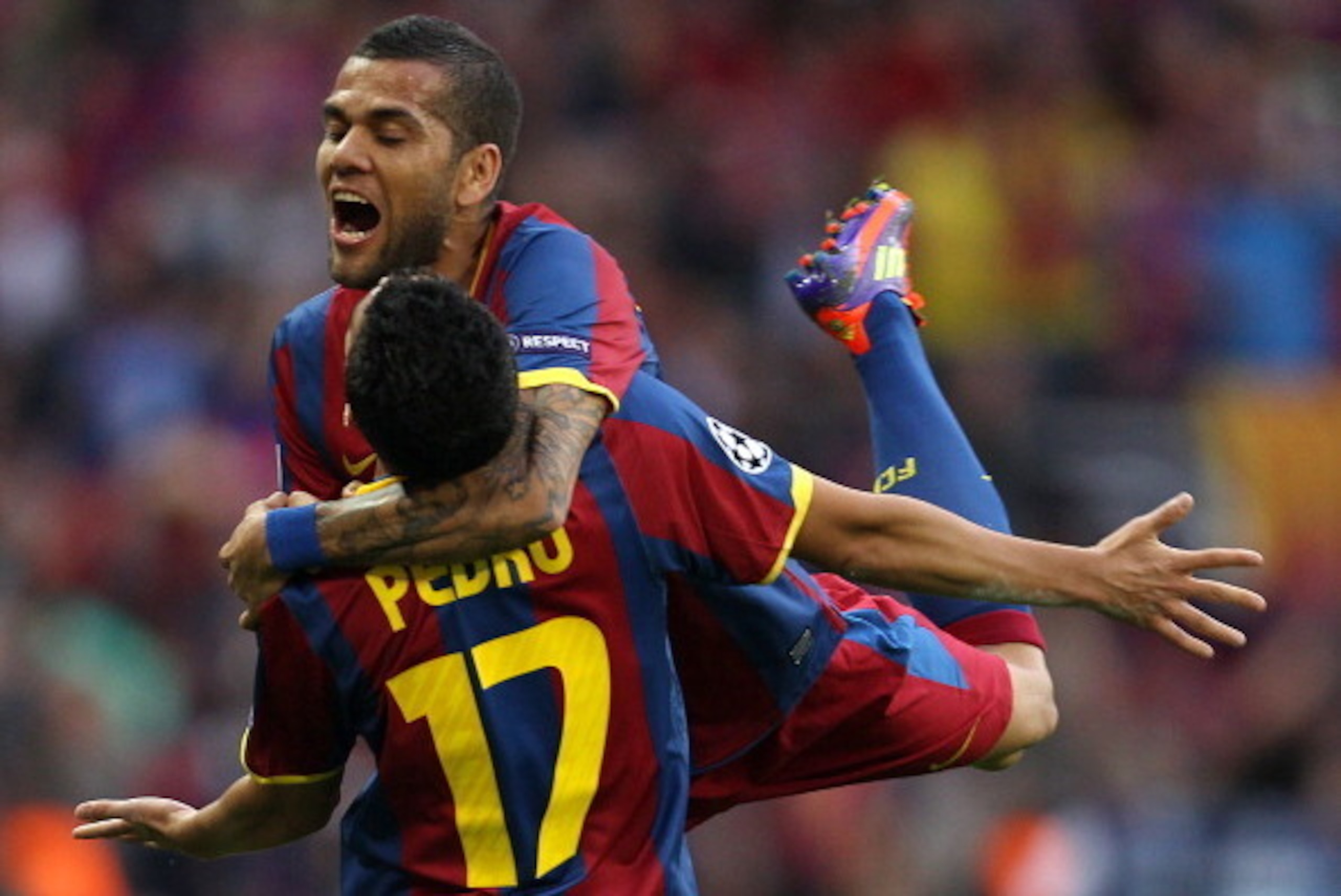 Barcelona's Spanish forward Pedro Rodriguez (L) is congratulated by Barcelona's Brazilian defender Dani Alves after scoring a goal during the UEFA Champions League final football match FC Barcelona vs. Manchester United, on May 28, 2011 at Wembley stadium