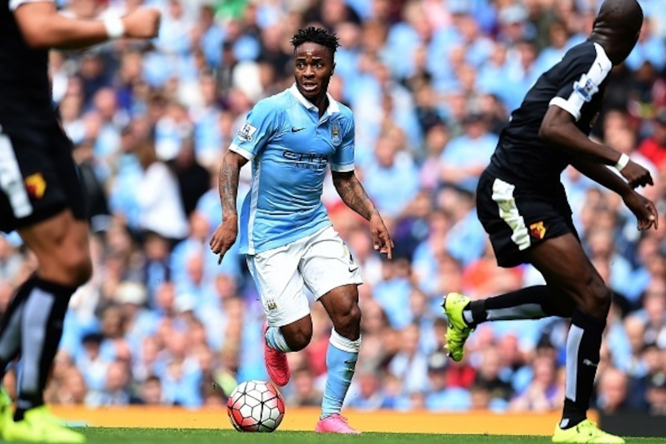 Manchester City's English midfielder Raheem Sterling runs with the ball during the English Premier League football match between Manchester City and Watford at The Etihad Stadium in Manchester, north west England on August 29, 2015. AFP PHOTO / PAUL ELLIS