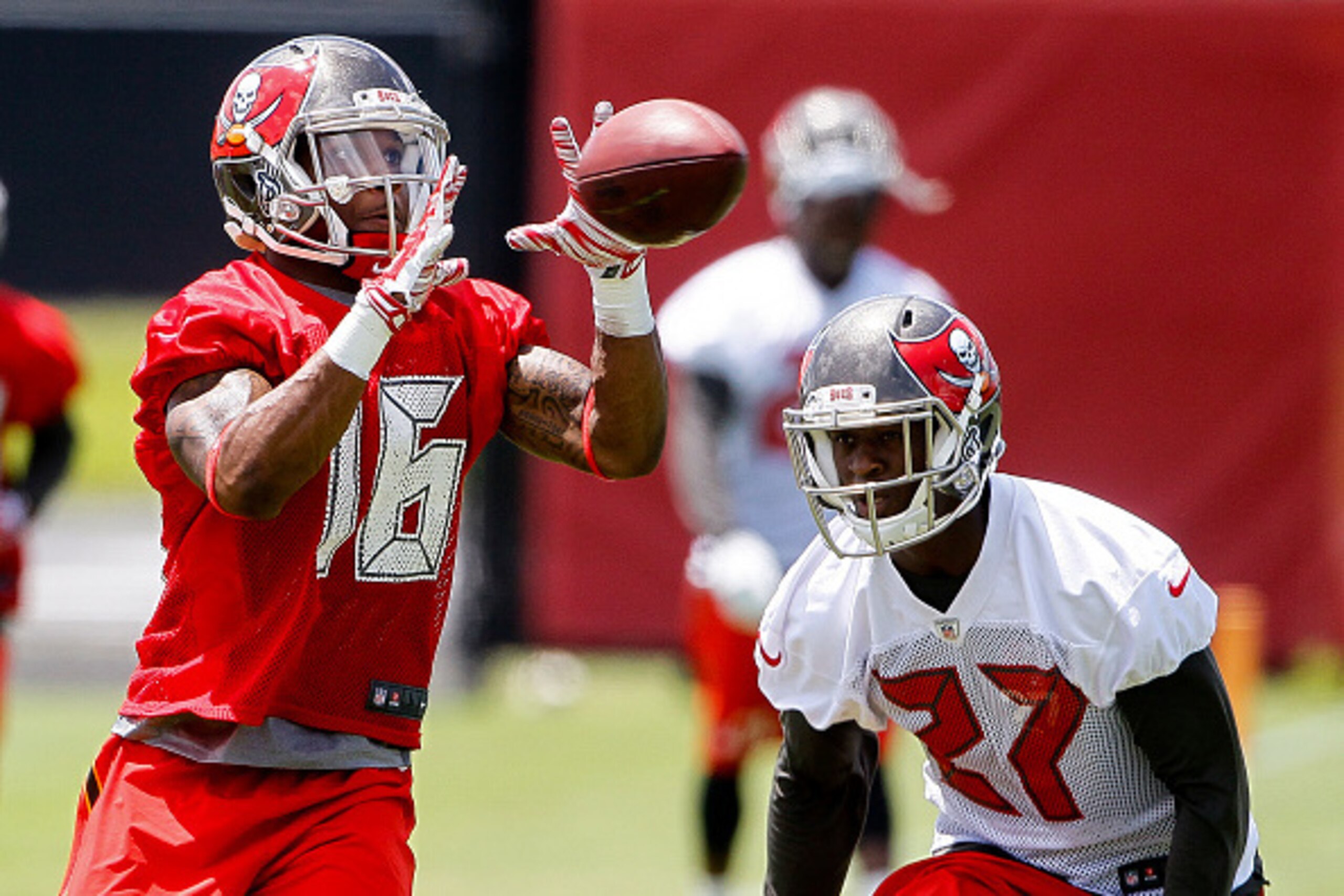 TAMPA, FL - MAY 28: Wide Receiver Rannell Hall #16 of the Tampa Bay Buccaneers makes a catch over Cornerback Johnthan Banks #27 during OTA's at One Buccaneer Place on May 28, 2015 in Tampa, Florida. (Photo by Don Juan Moore/Getty Images)
